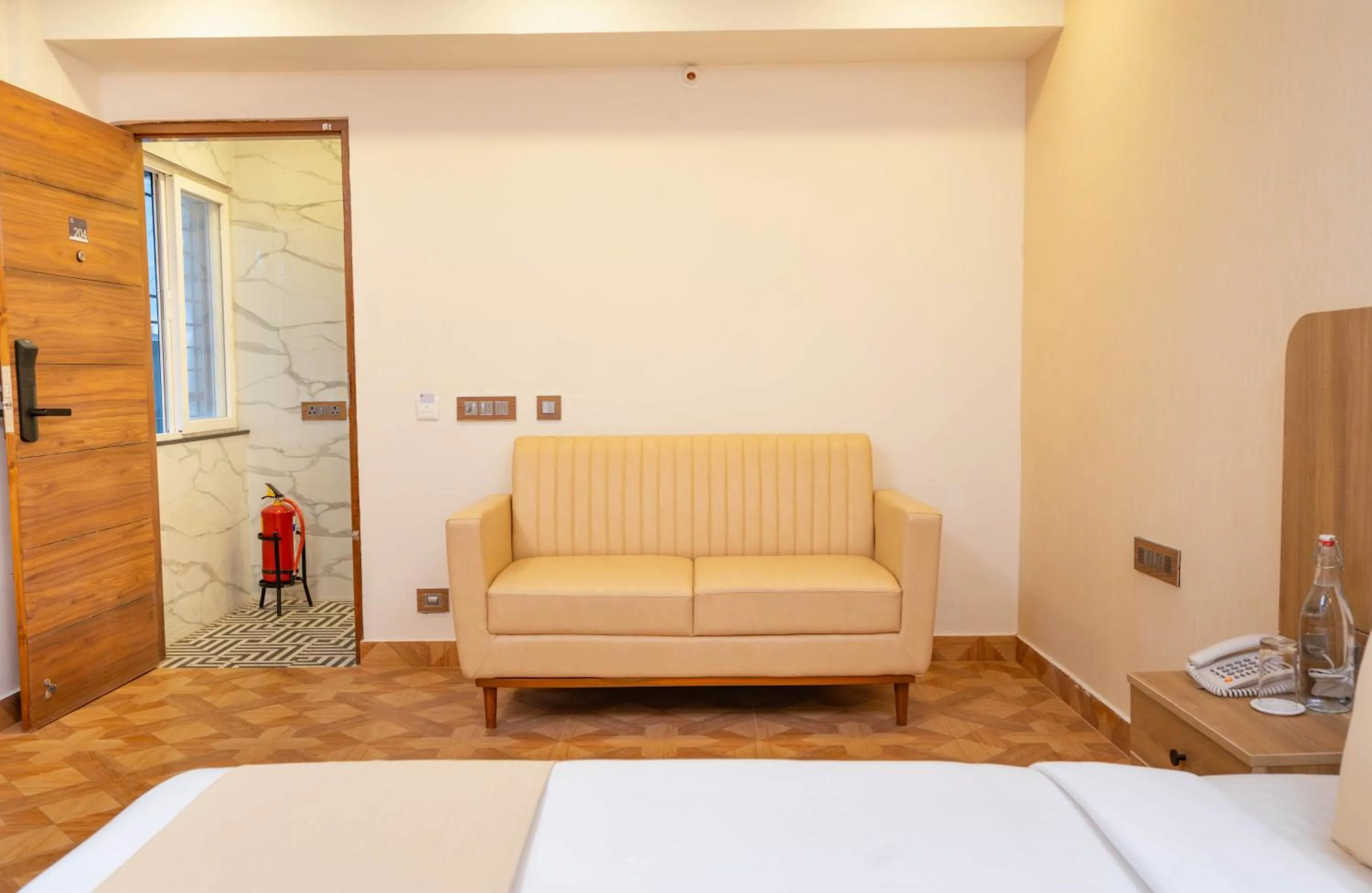 Seating area, Bed in HZ Bangalore Stories