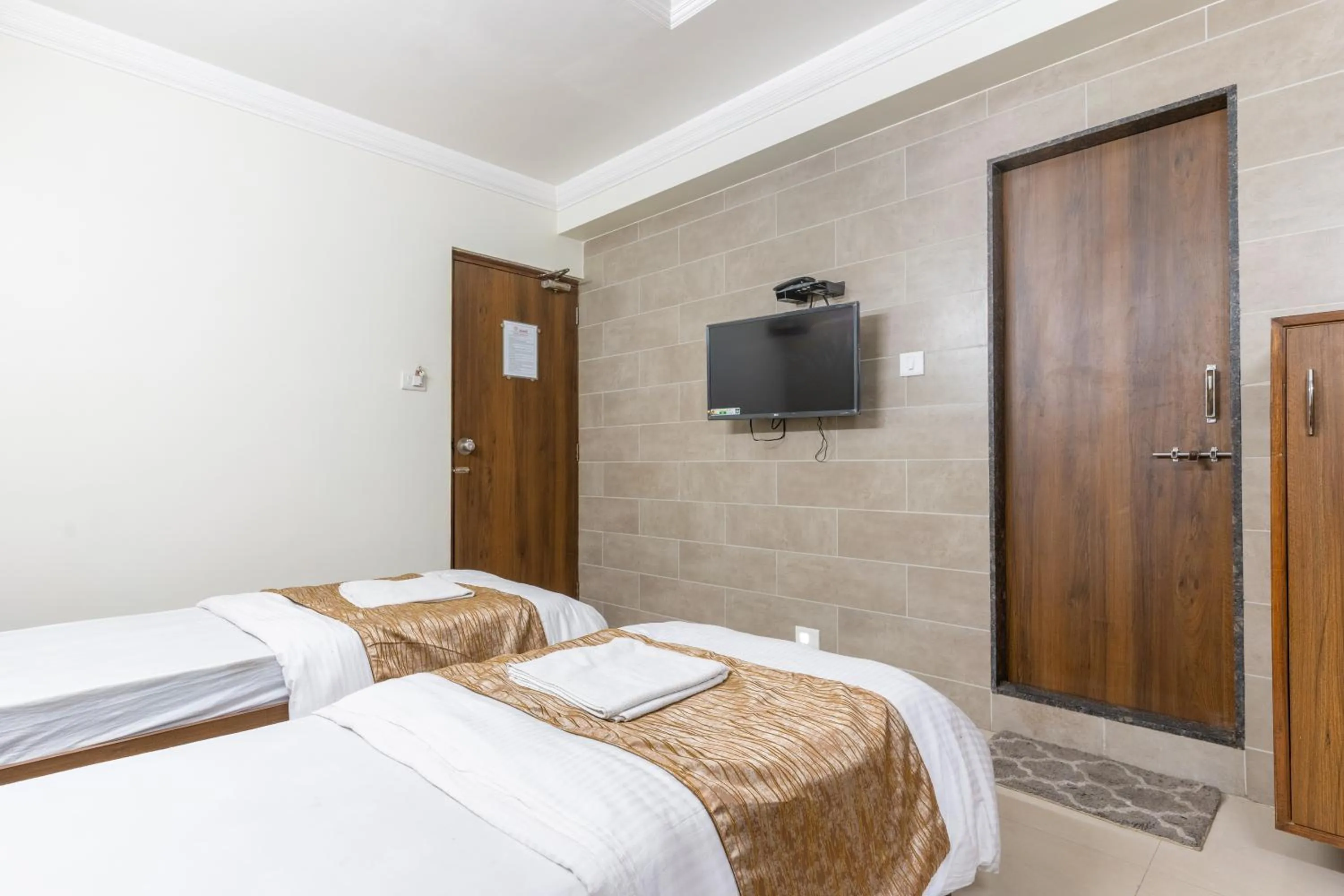 Bed in Hotel Sanmati