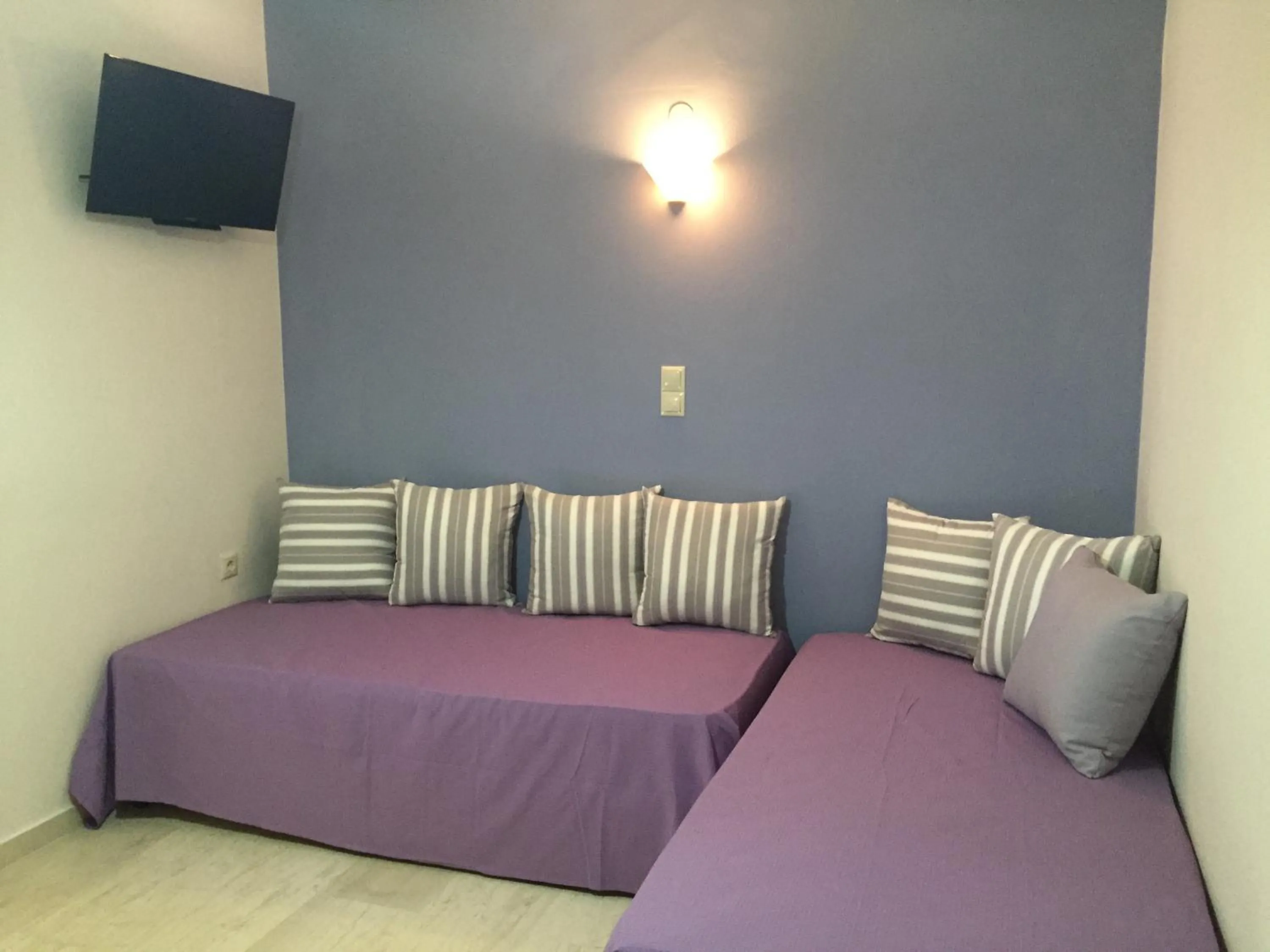 Living room, Bed in Apollon Hotel