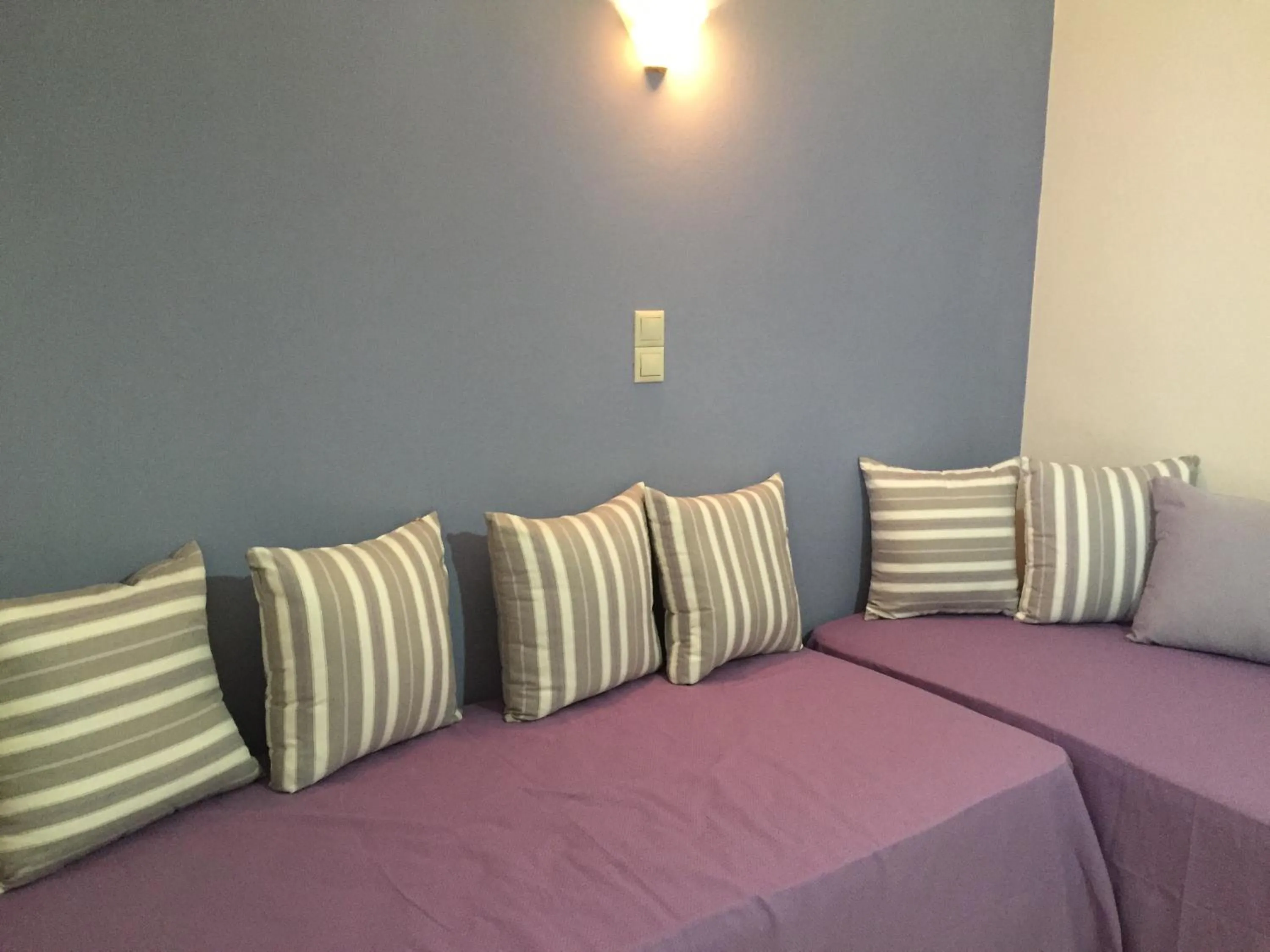Living room, Bed in Apollon Hotel