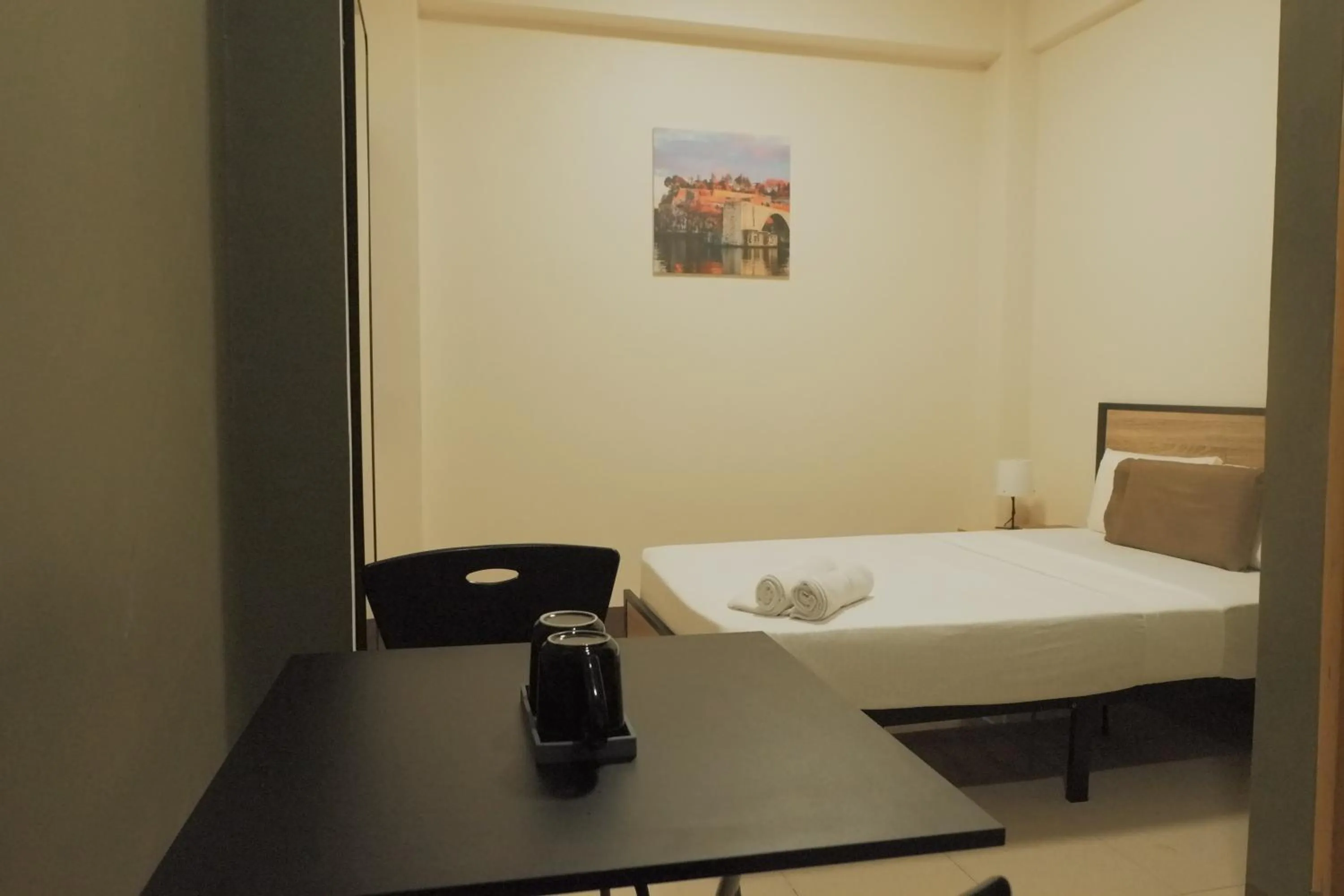 Bed in Brightwood Hotel & Residences