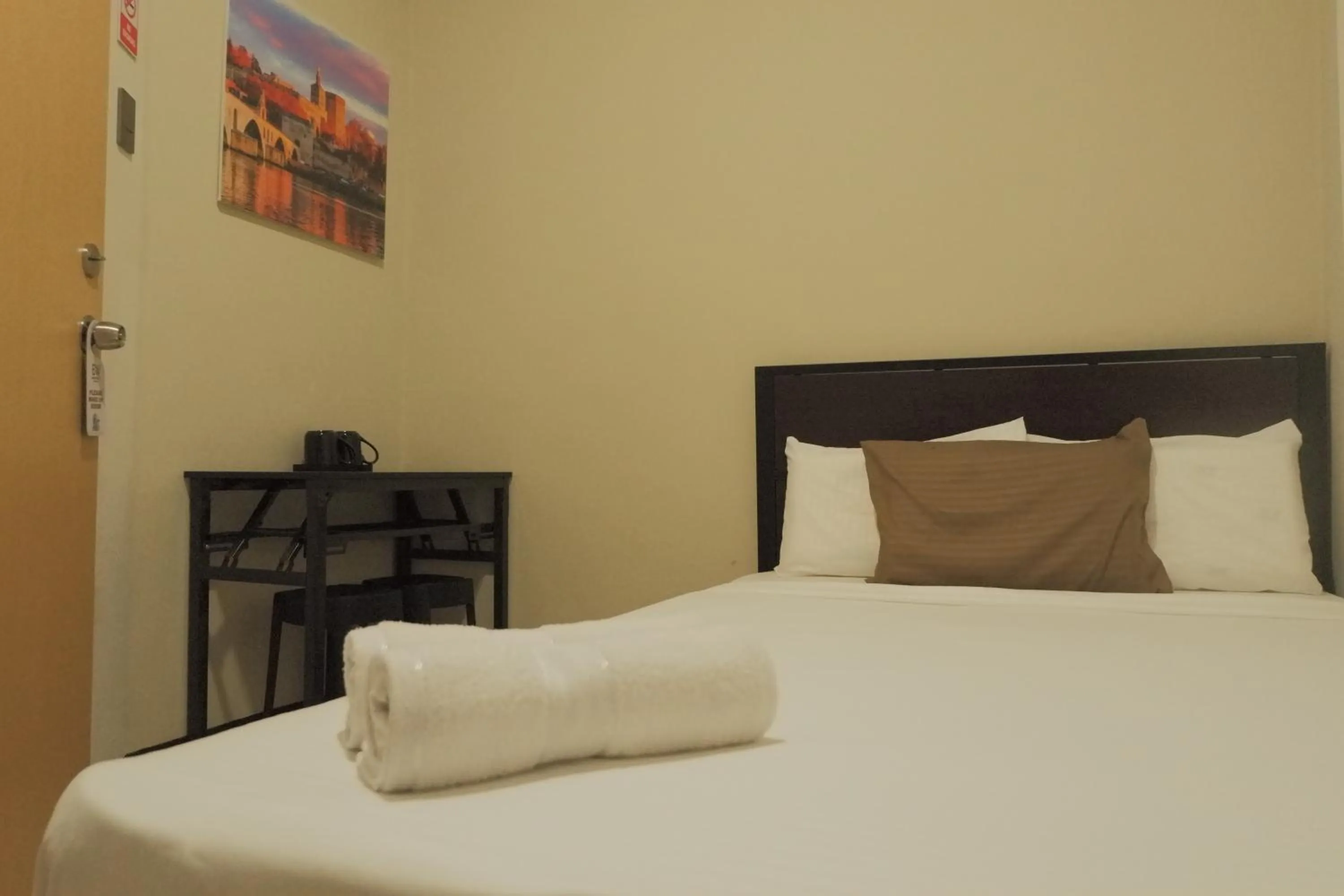 Bed in Brightwood Hotel & Residences