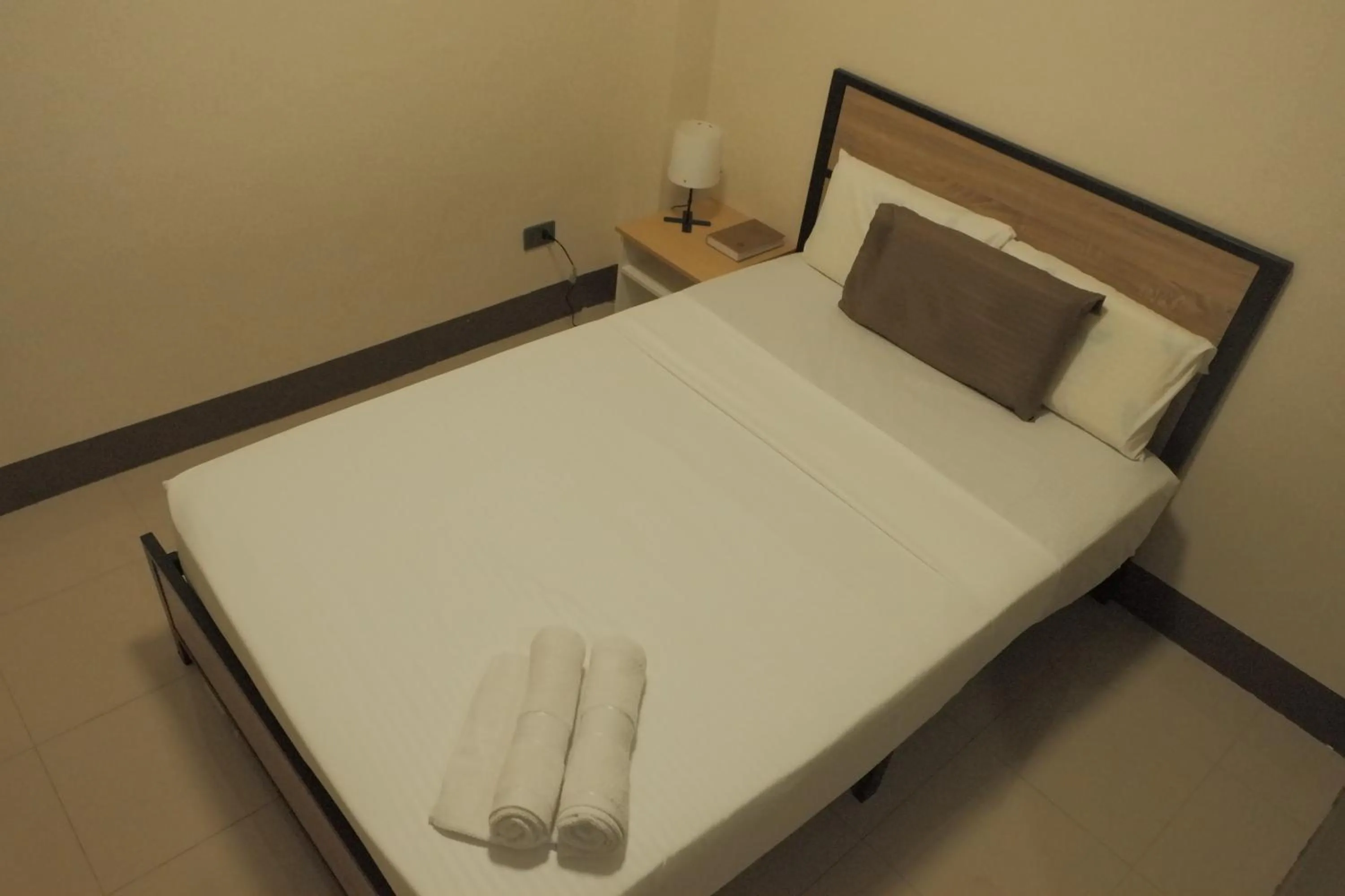Bed in Brightwood Hotel & Residences