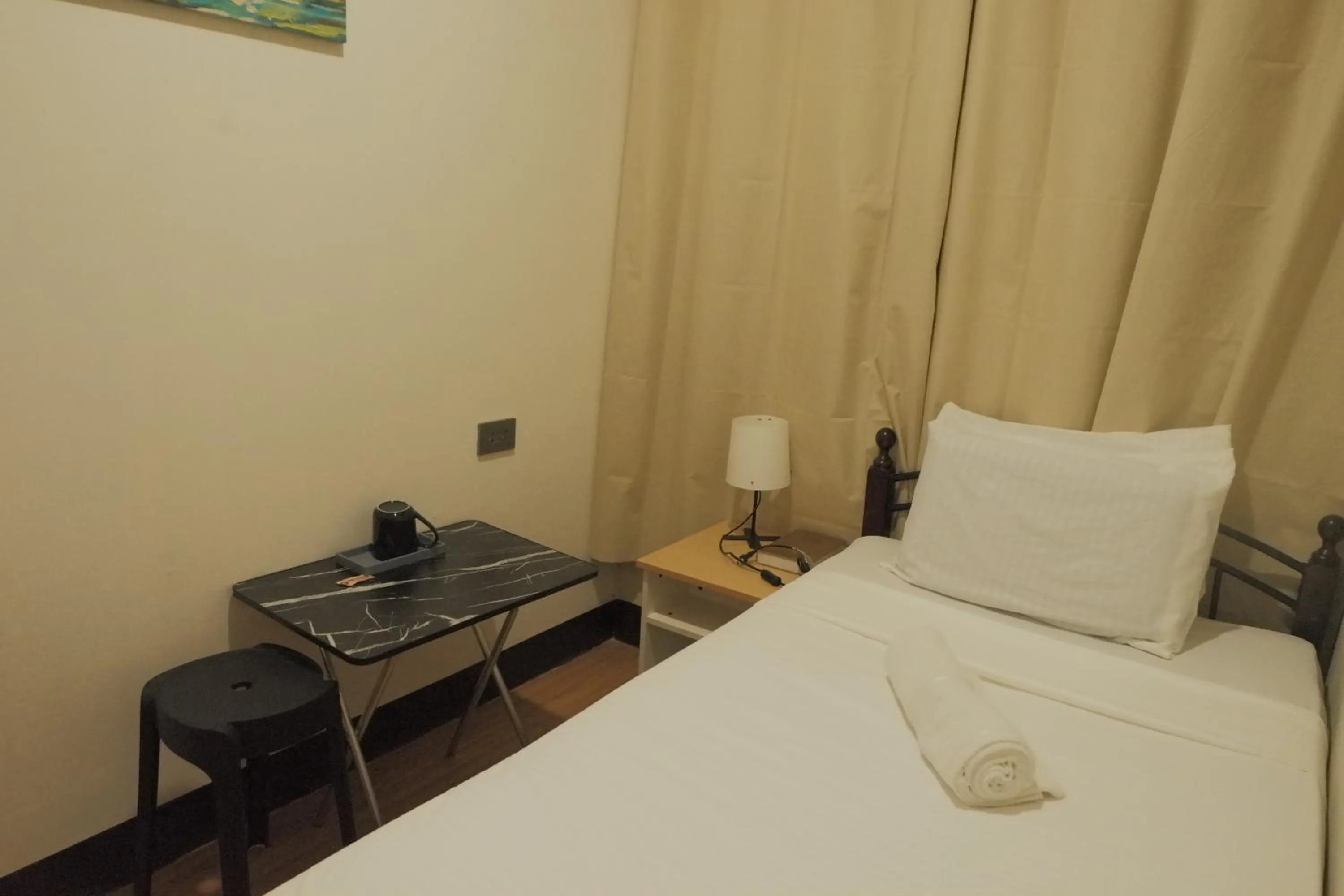 Bed in Brightwood Hotel & Residences