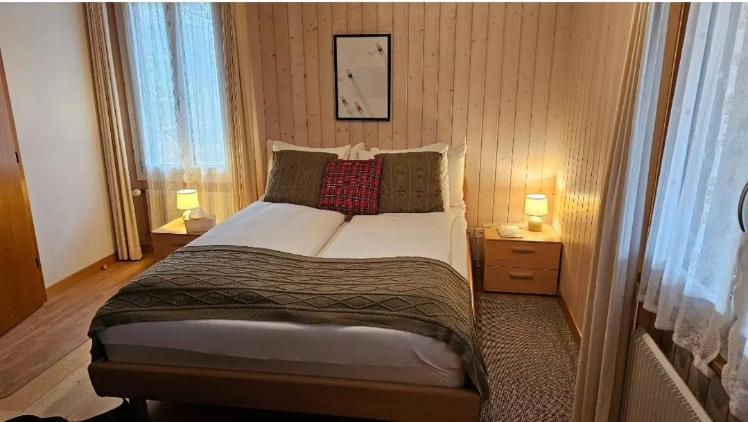 Photo of the whole room, Bed in Alpina Boutique Hotel Interlaken - Ringgenberg - Adults only !