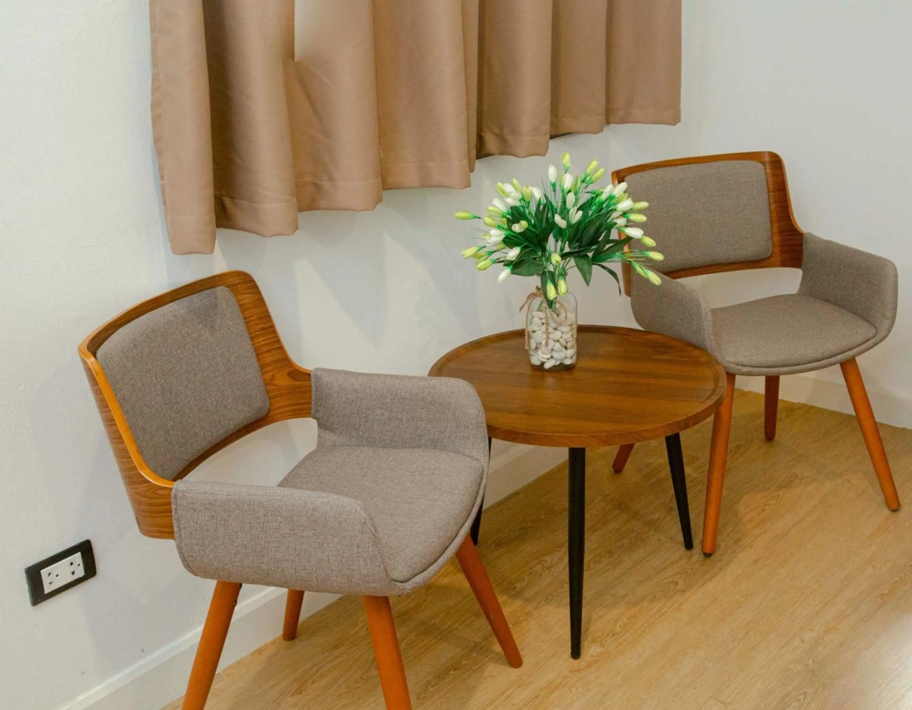 Seating area in RQ Phuket Patong Beach by Collection O