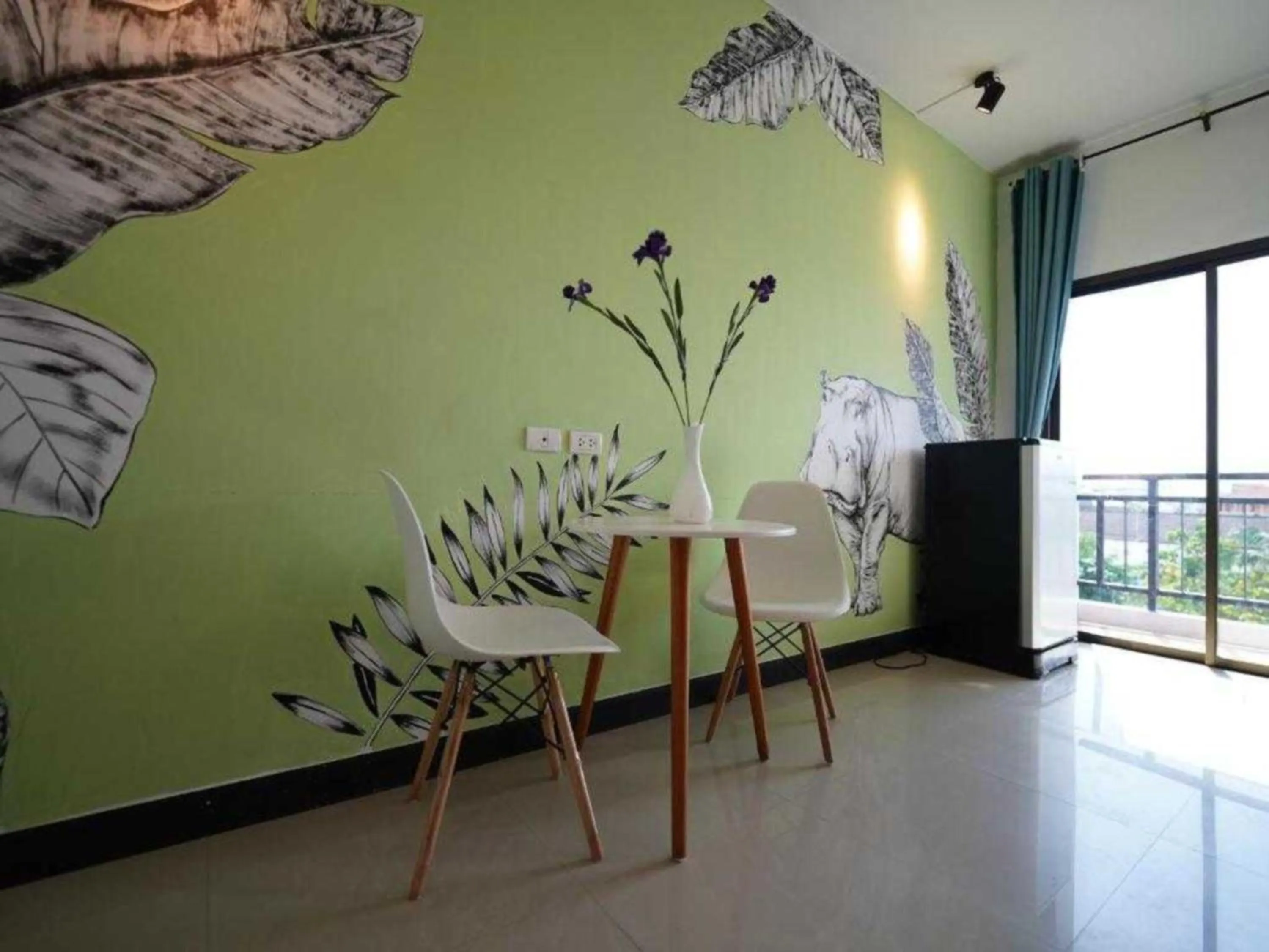 Seating area in RQ Phuket Patong Beach by Collection O