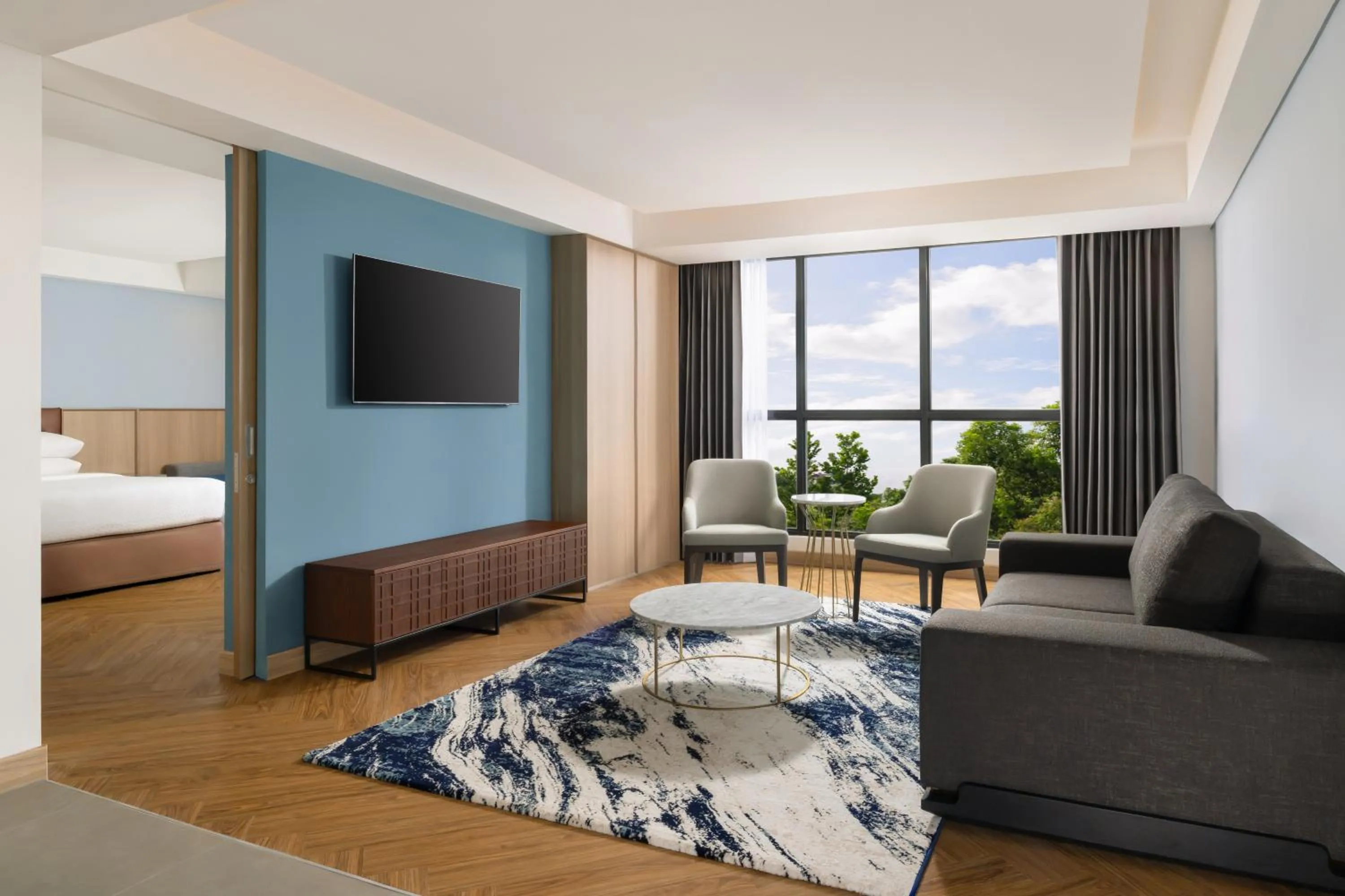 Living room, Bed in Four Points by Sheraton Pontianak