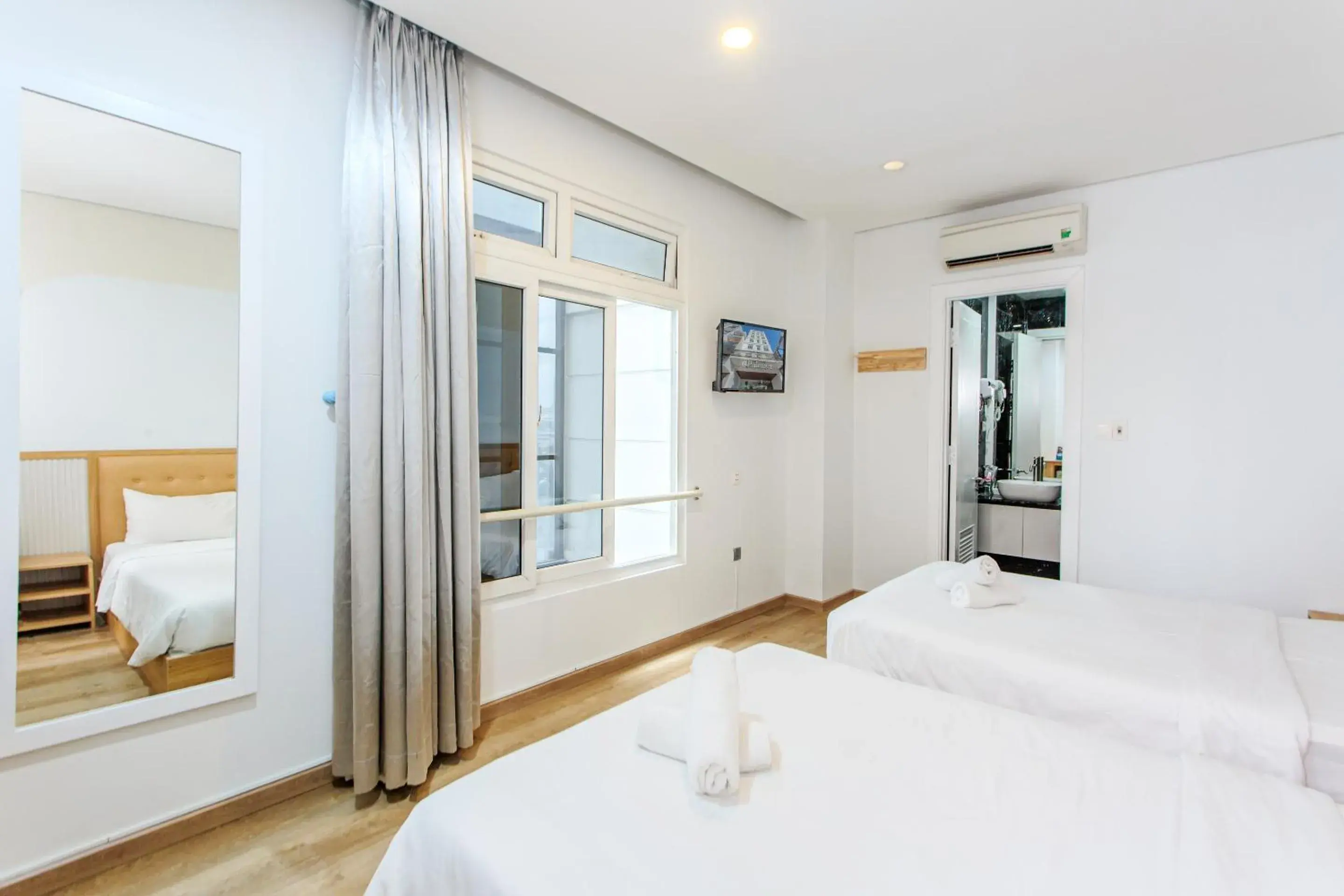 Deluxe Double Room with Two Double Beds in Palmier Hotel - Art House Da Nang Deluxe Double Room with Two Double Beds in Palmier Hotel - Art House Da Nang