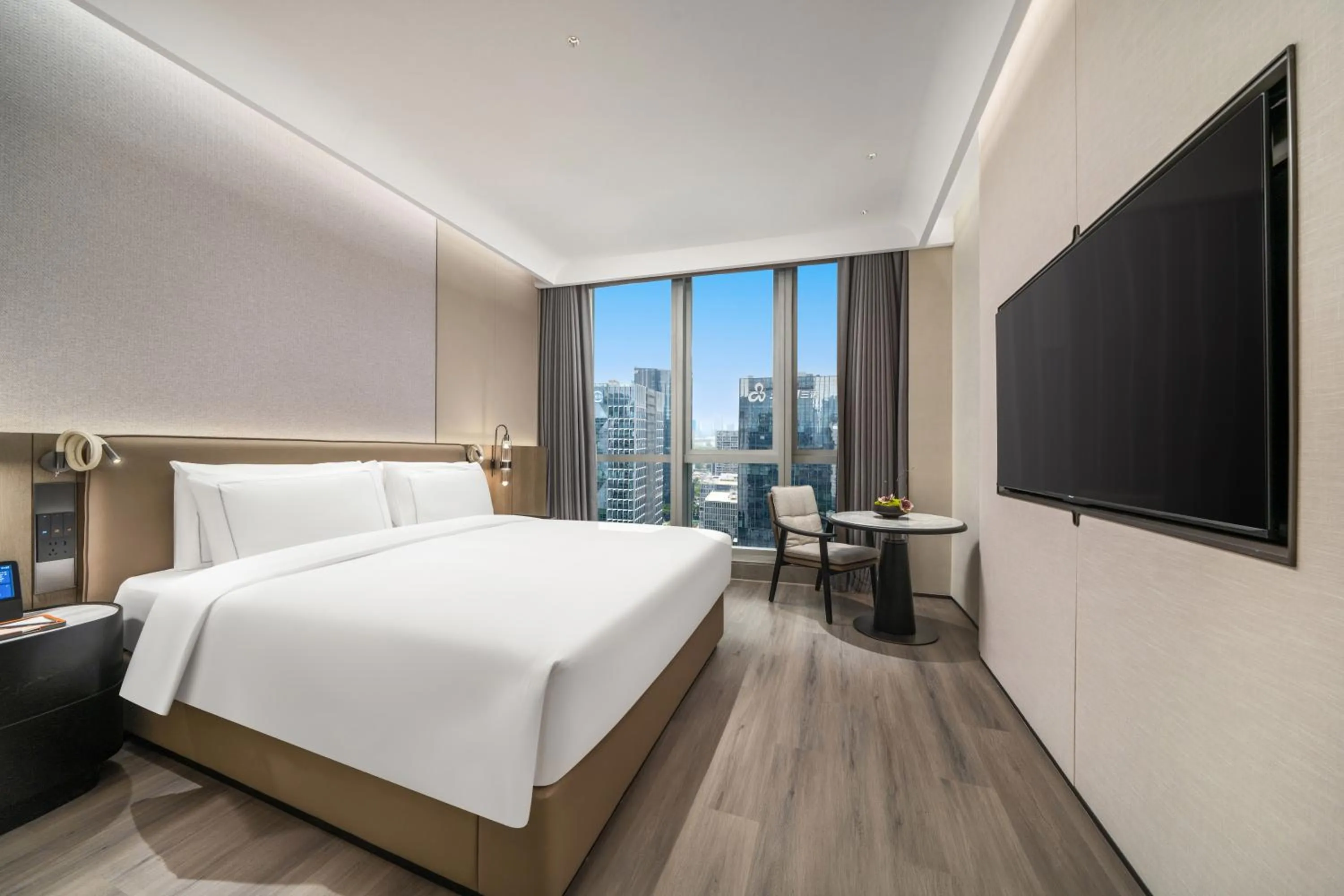 Communal lounge/ TV room, Bed in UrCove by Hyatt Shenzhen Bay Mixc