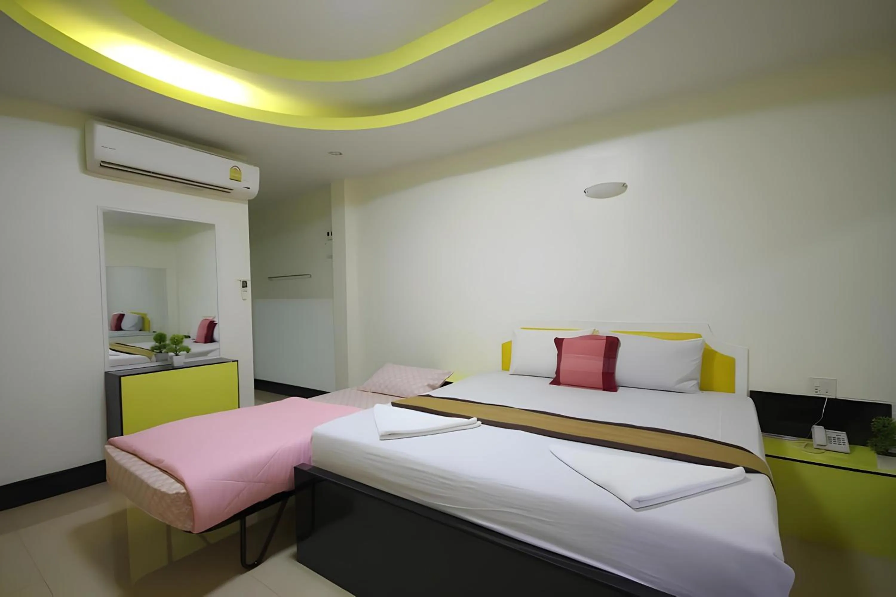 Bed in The Windsor Boutique Resort