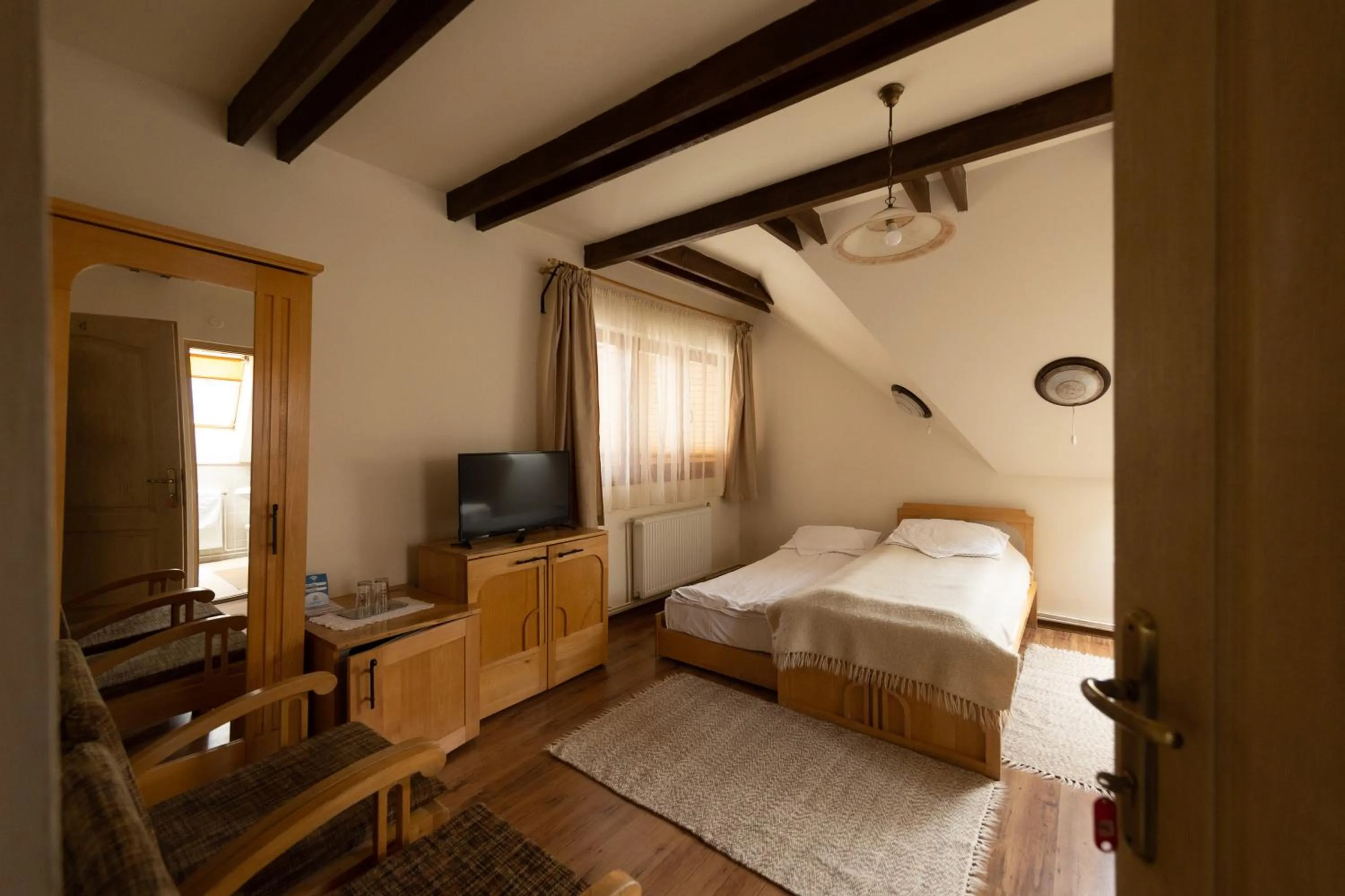 Bed in Pensiunea Bella Vita