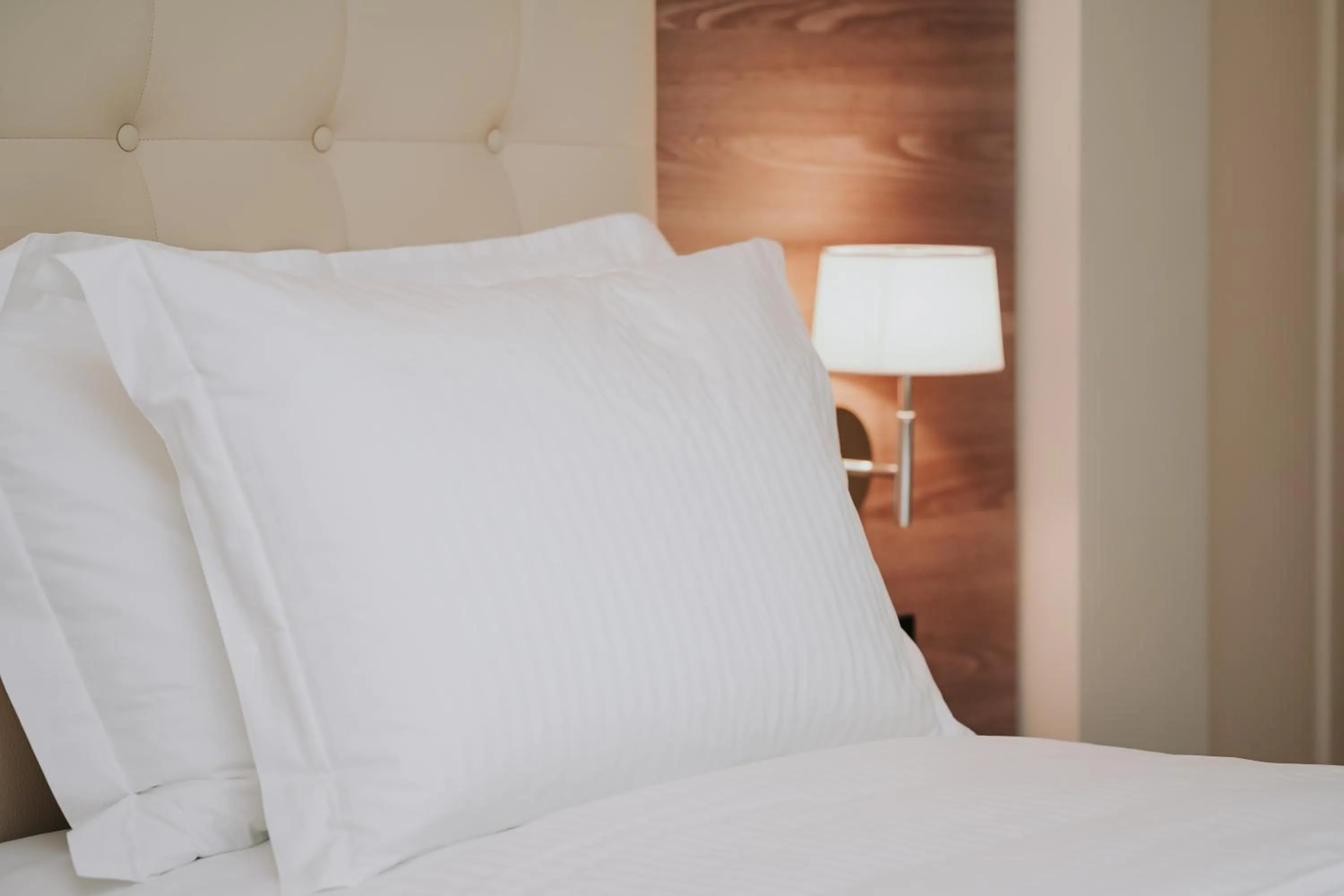 Bed in Magnus Hotel & SPA