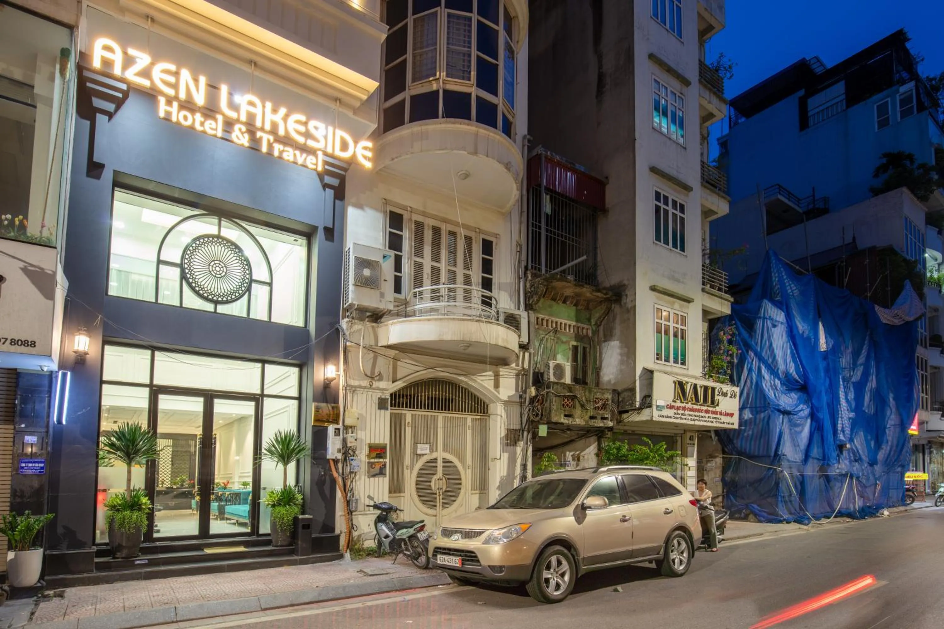 Property building in Azen Lakeside Hotel & Travel