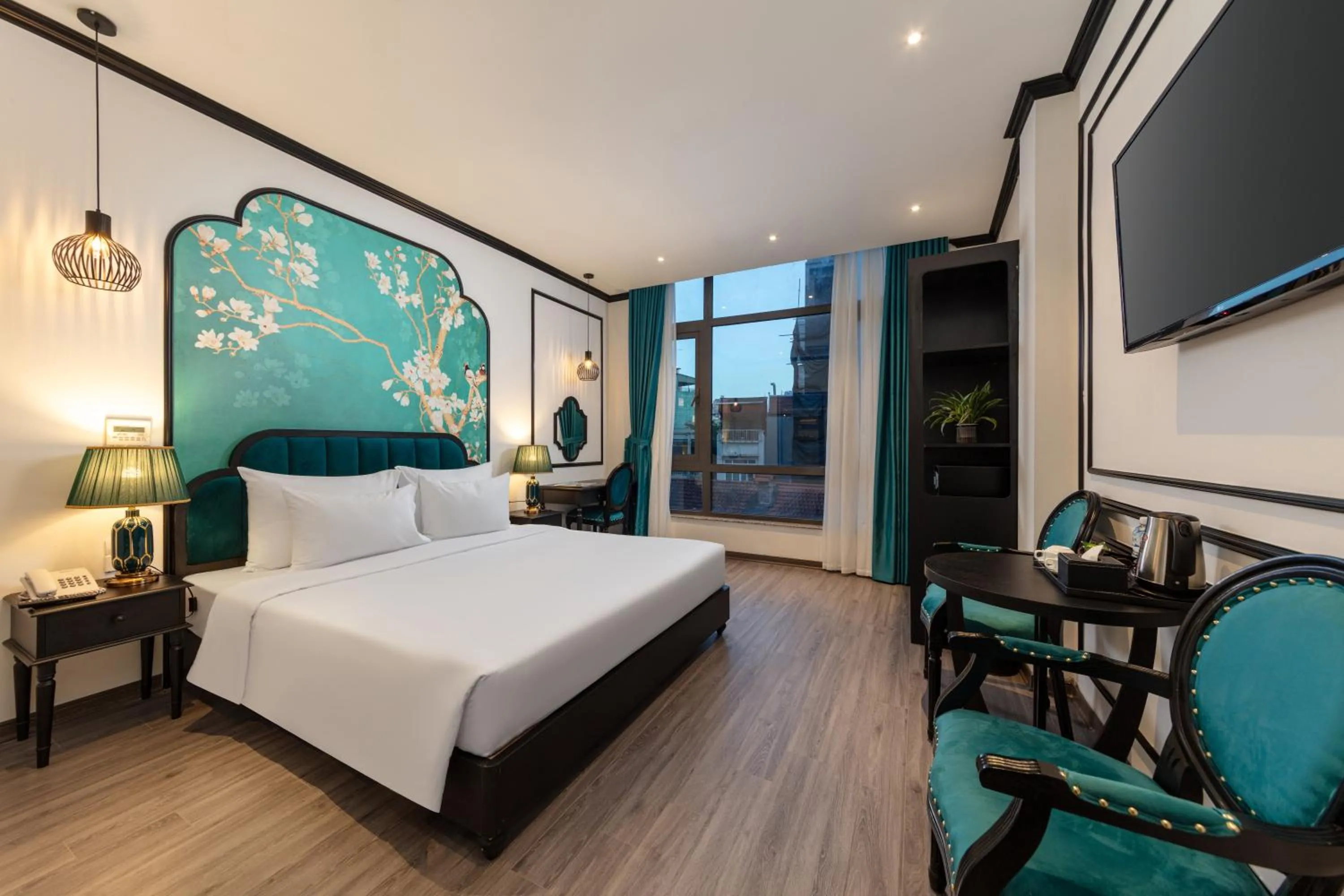 Communal lounge/ TV room, Bed in Azen Lakeside Hotel & Travel