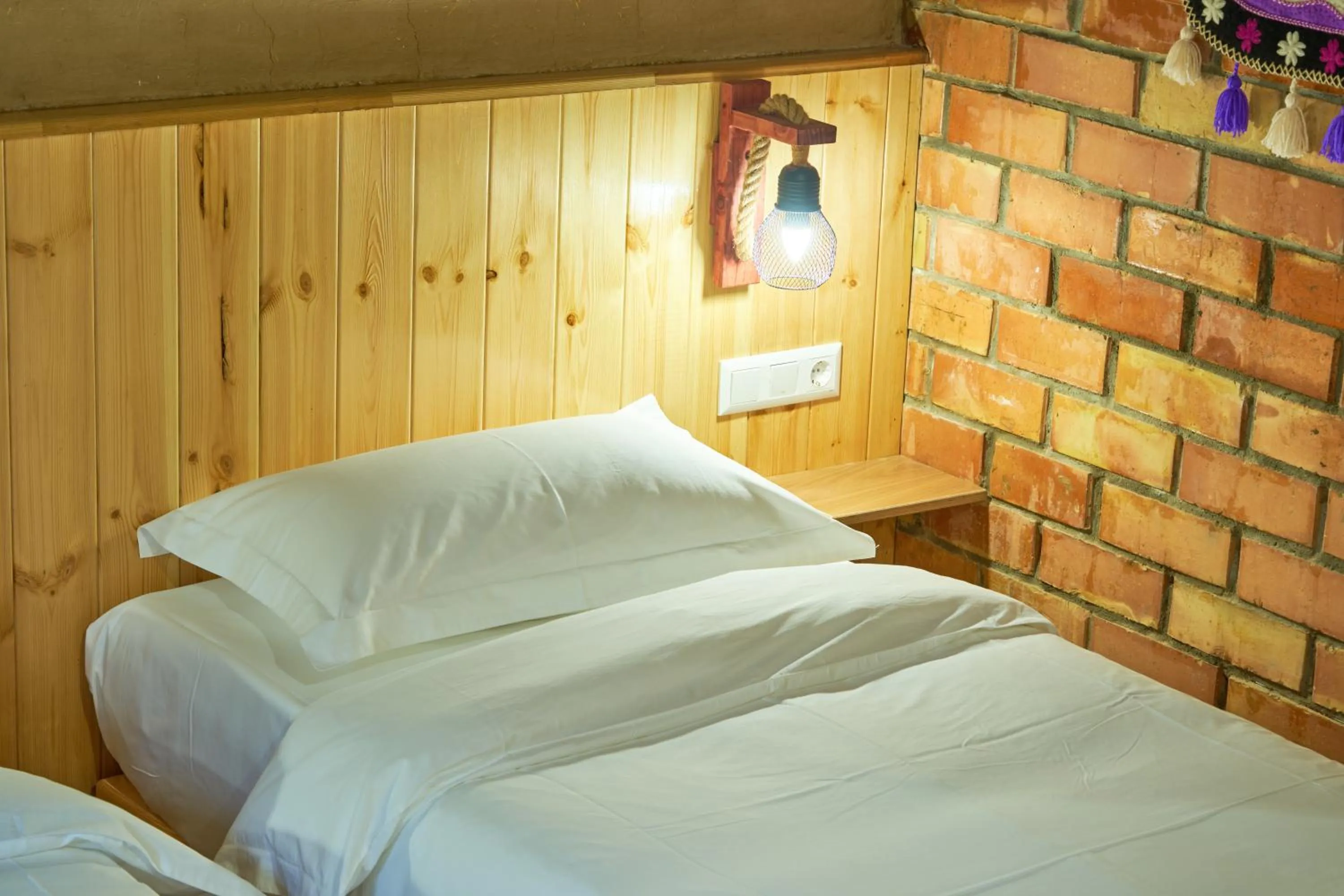 Bed in Pristine Hotel