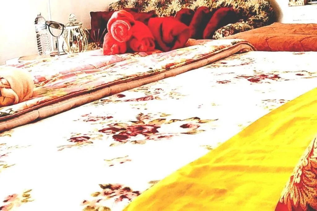 Bed in ITALIA GUESTHOUSe