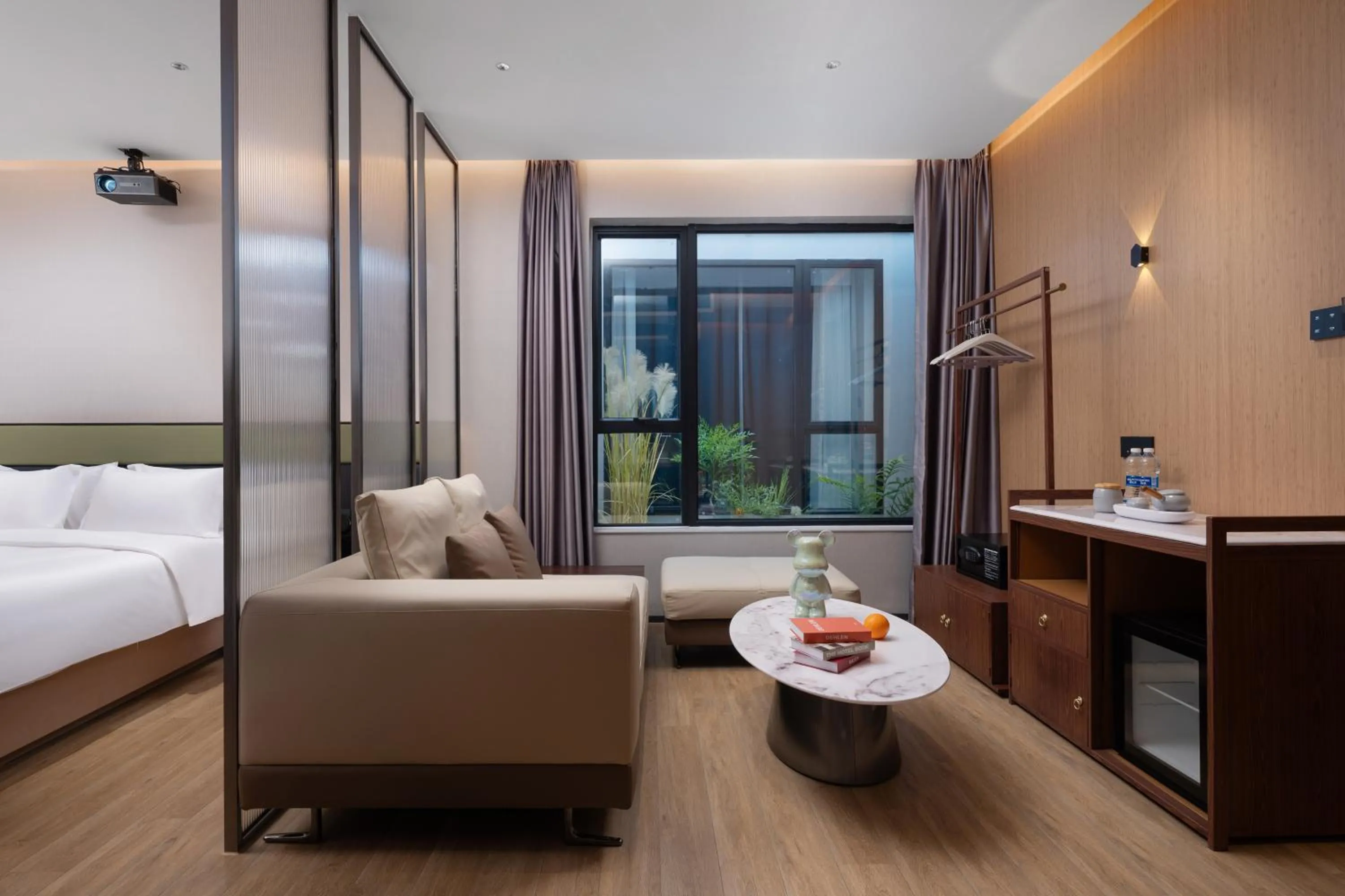 Living room, Bed in Kaino Natural Aesthetics Design Hotel Guangzhou Yuexiu Beijing Road International Trade Center Flagship Store