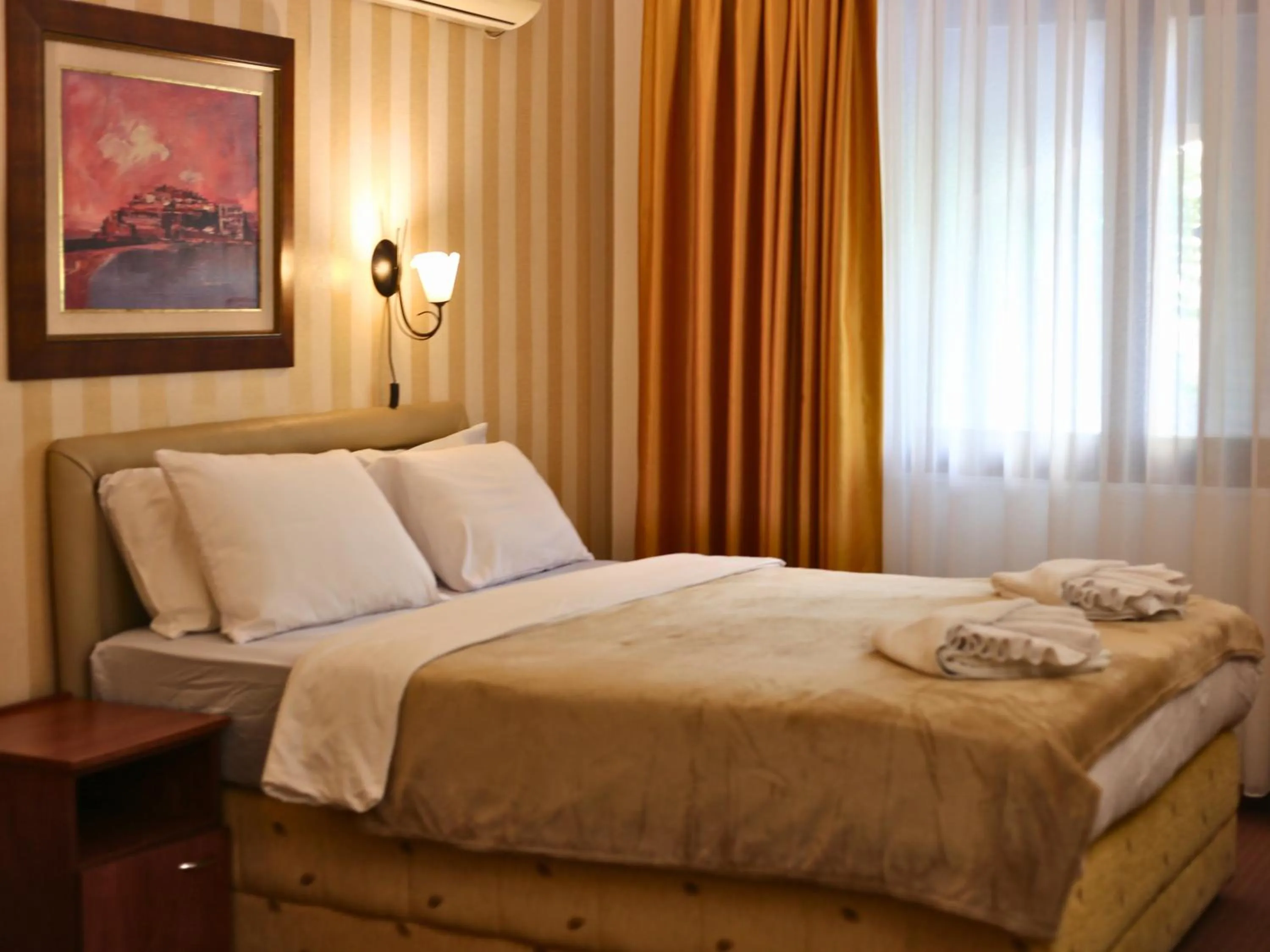 Bed in Central Hotel & Restaurant