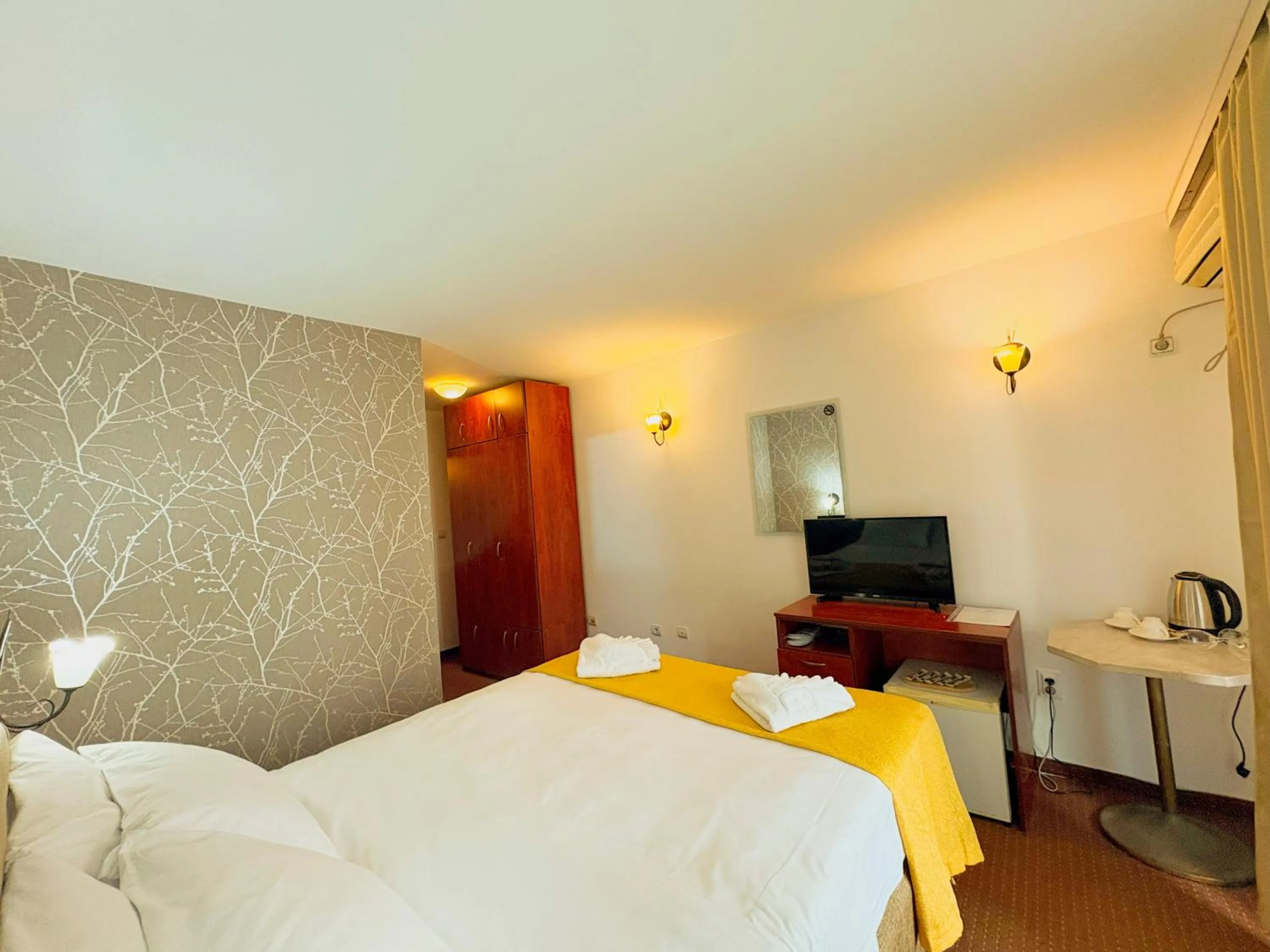 Bed in Central Hotel & Restaurant