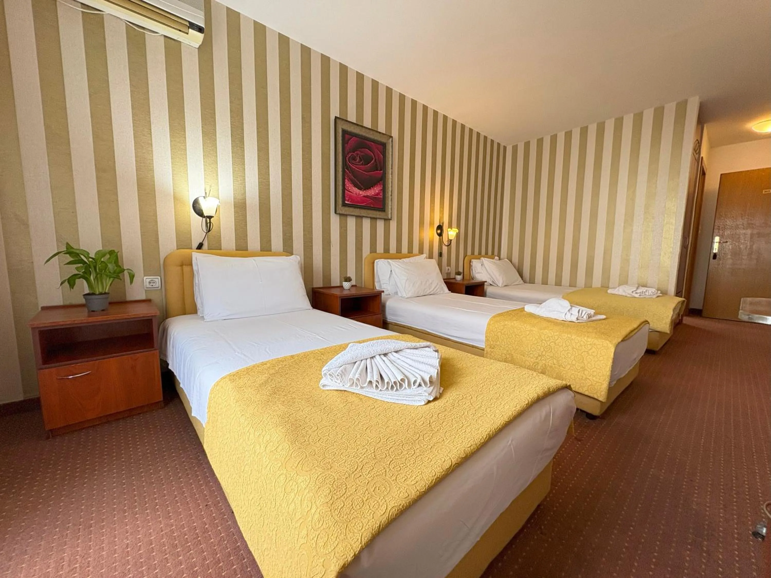 Bed in Central Hotel & Restaurant