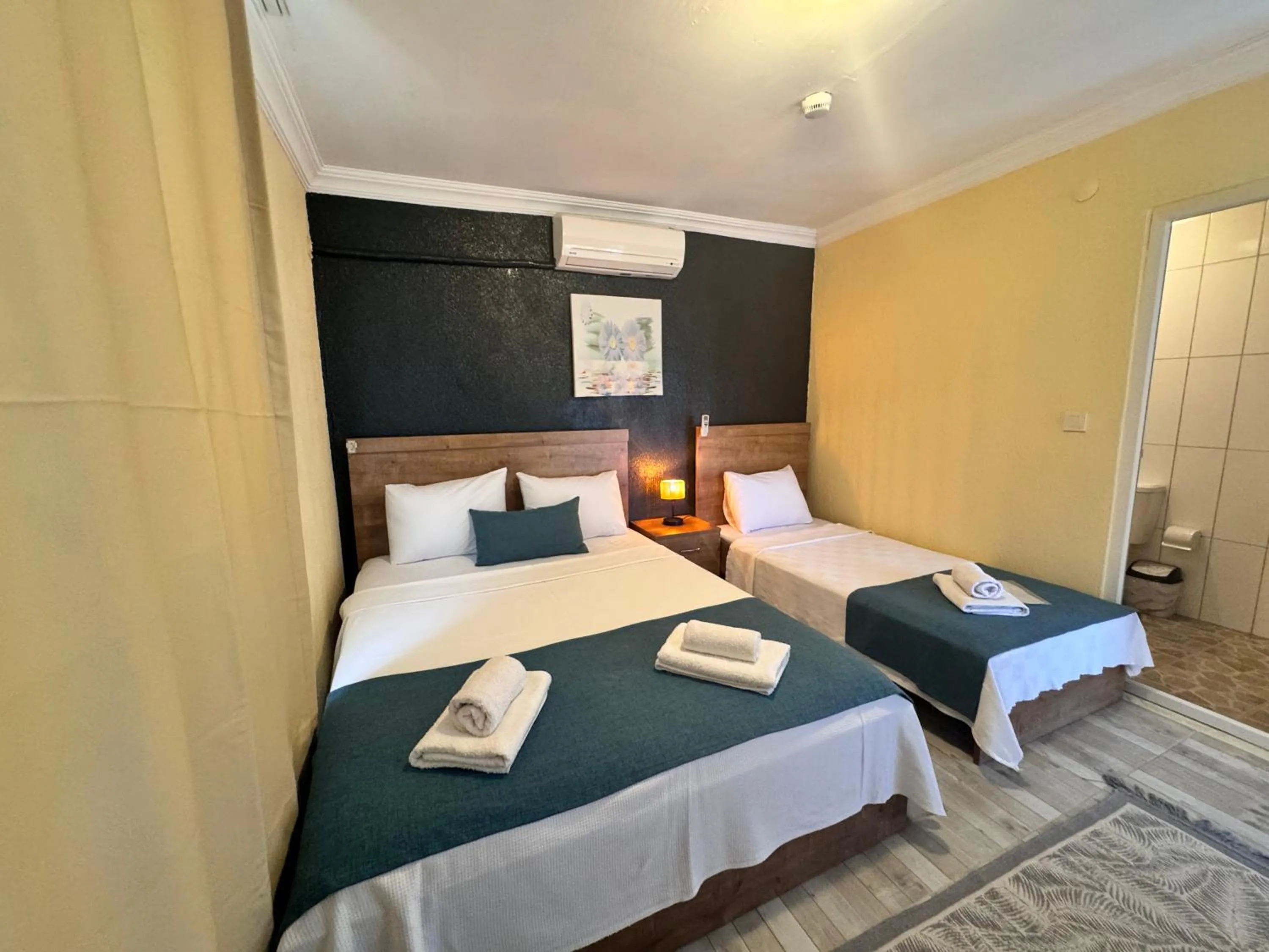 Bed in La Dia Hotel Faralya