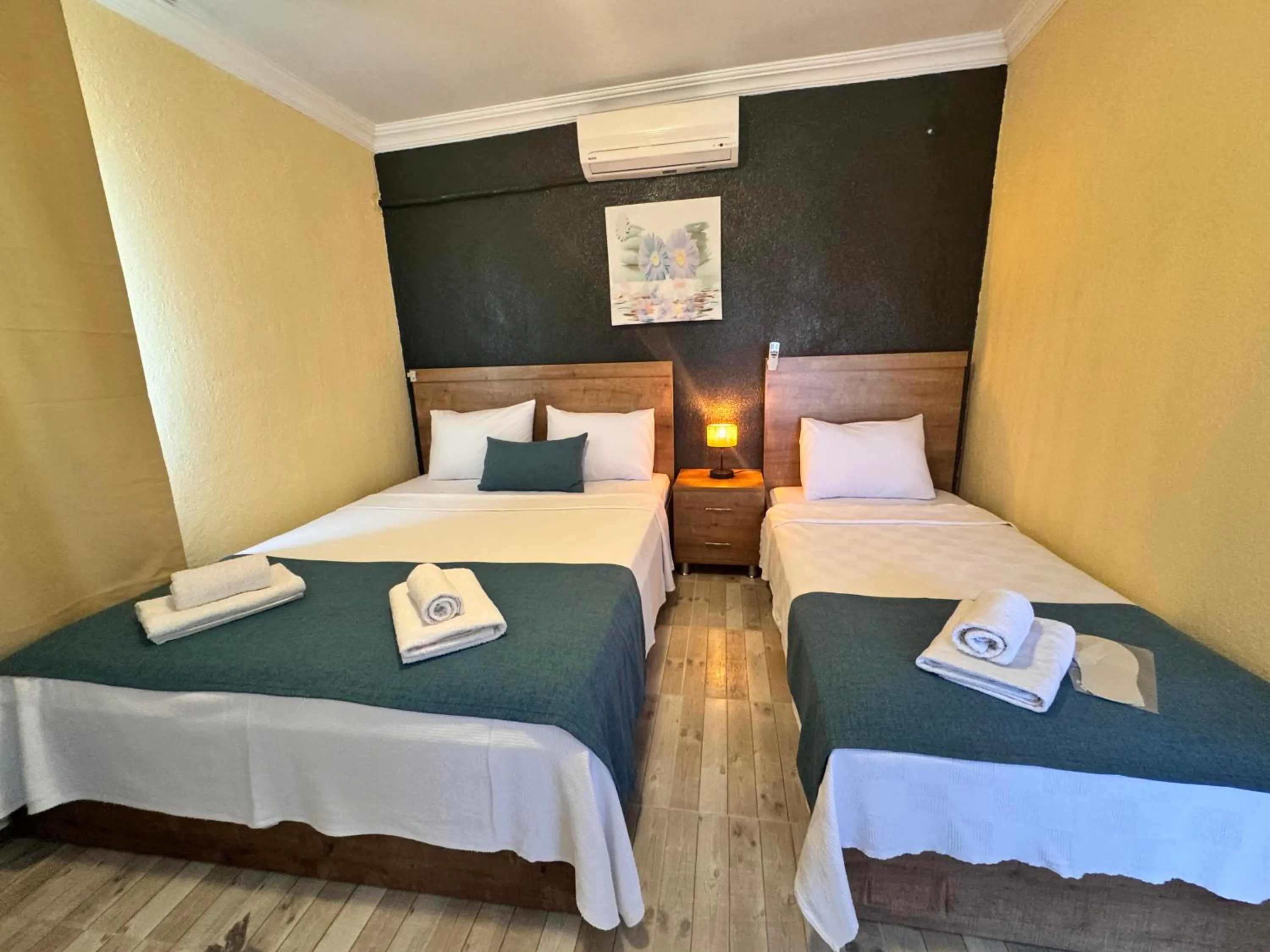 Bed in La Dia Hotel Faralya