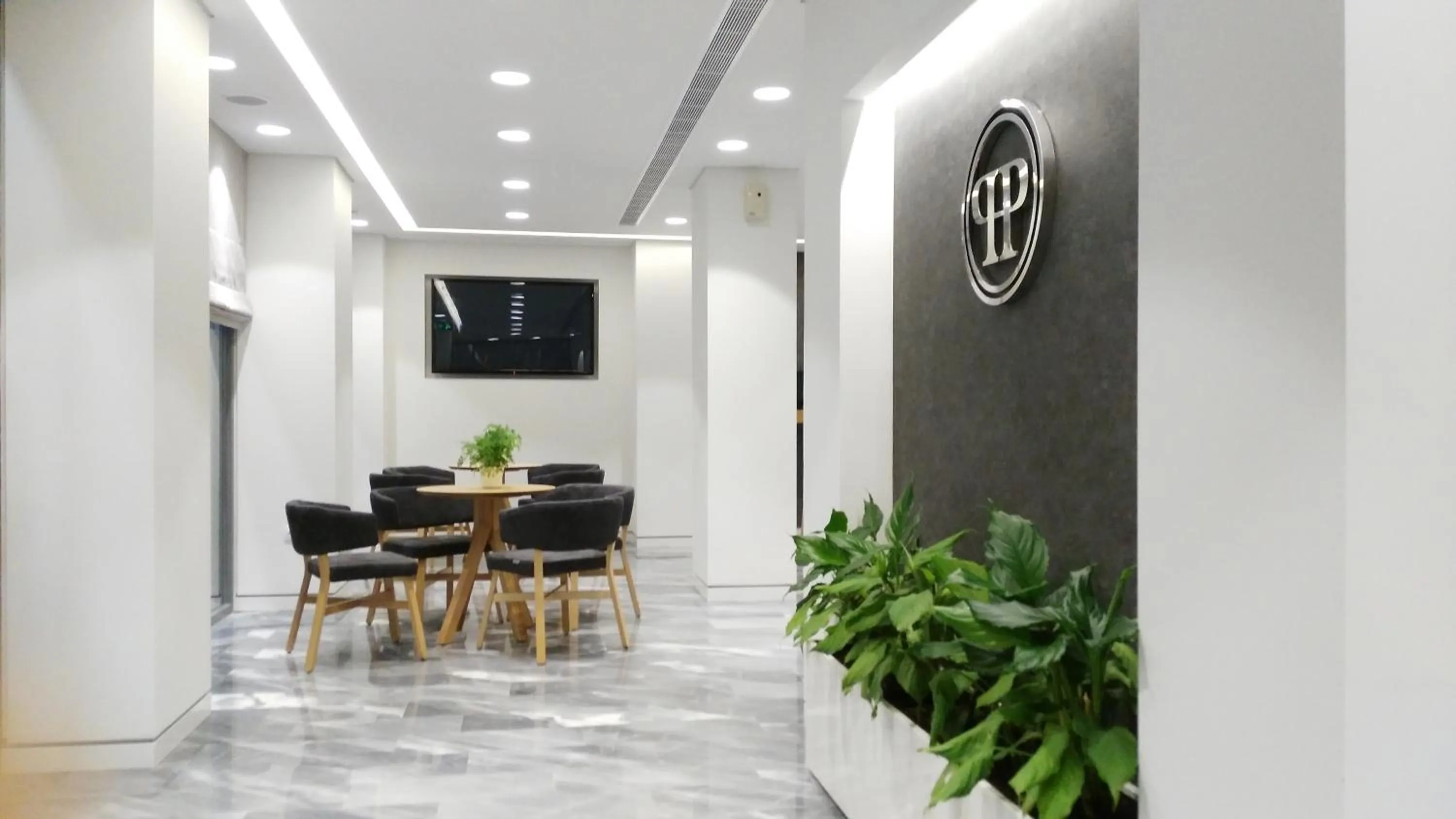 Communal lounge/ TV room in Piraeus Port Hotel