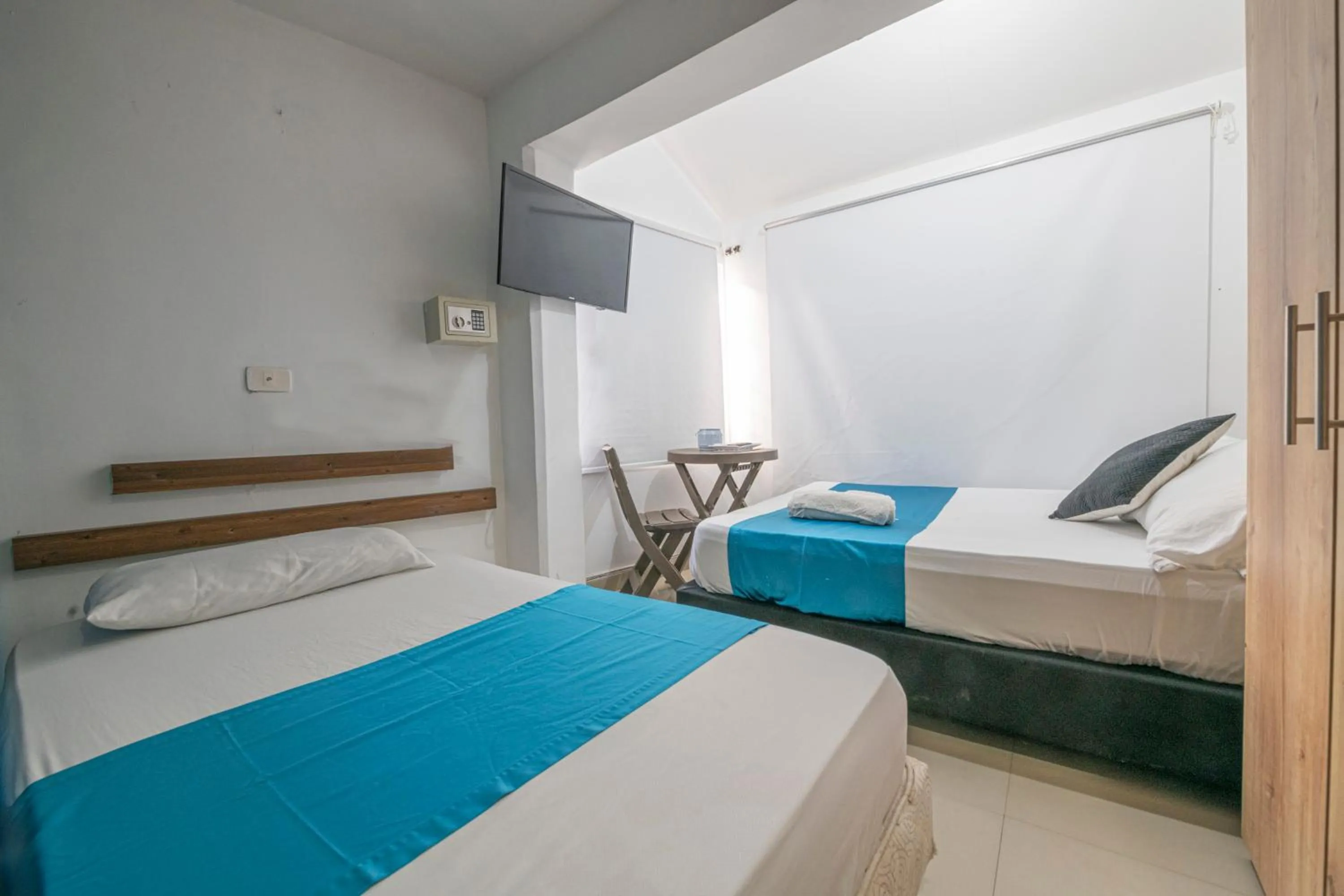 Bed in Sweet Caribbean Airport Hotel