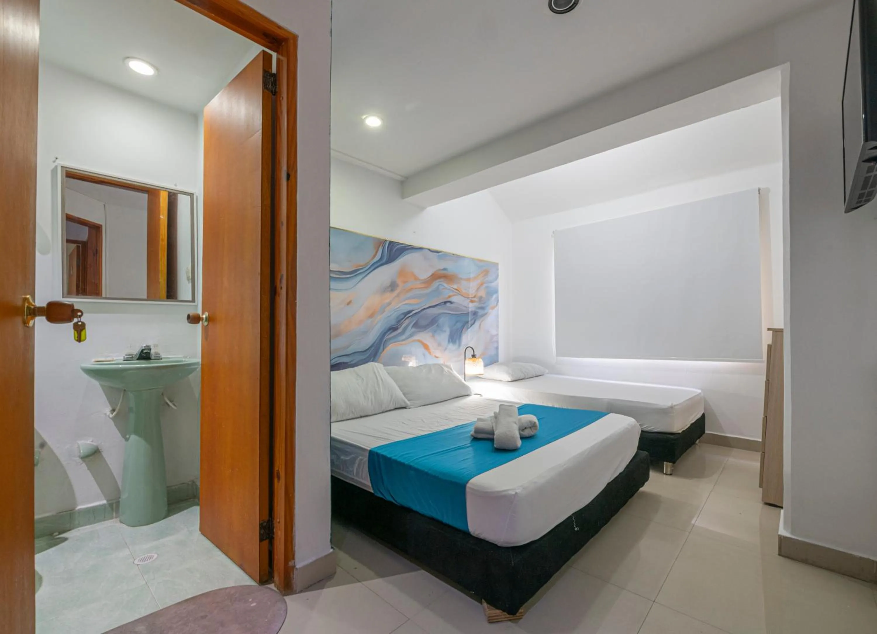 Bed in Sweet Caribbean Airport Hotel