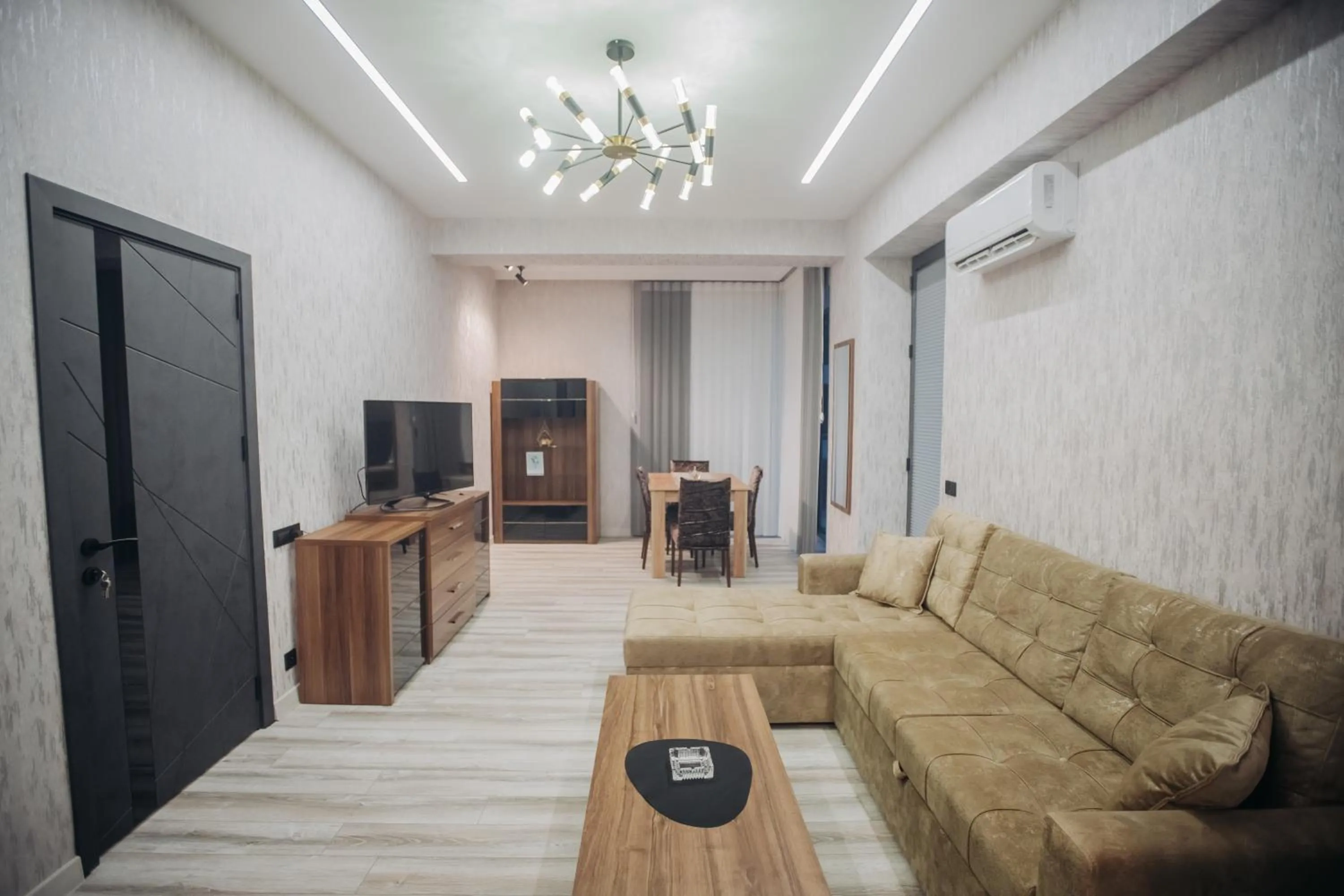 Communal lounge/ TV room in Sabah Bayil Residence Family Apart