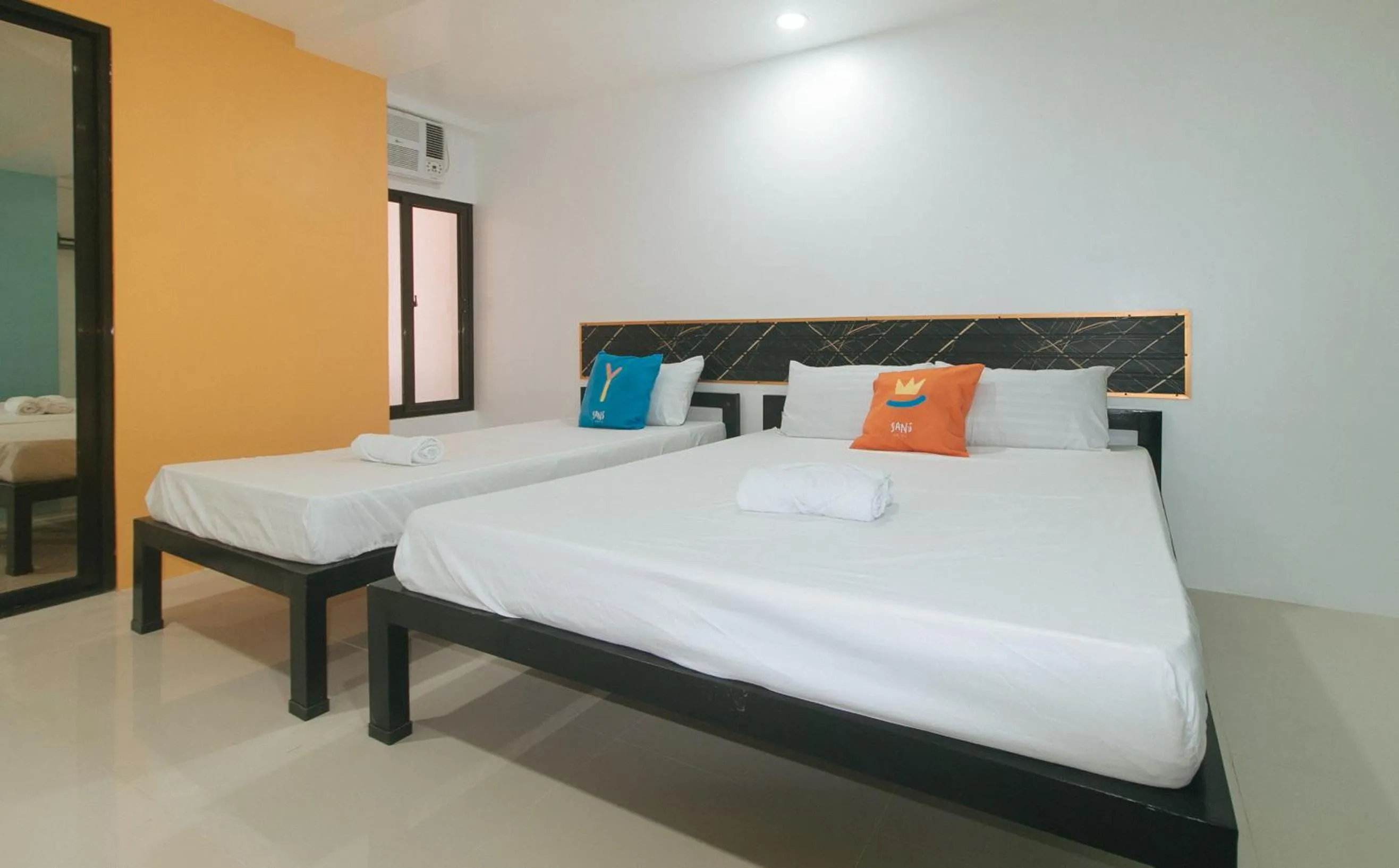 Bed in Sans Hotel near Enchanted Kingdom Santa Rosa Laguna