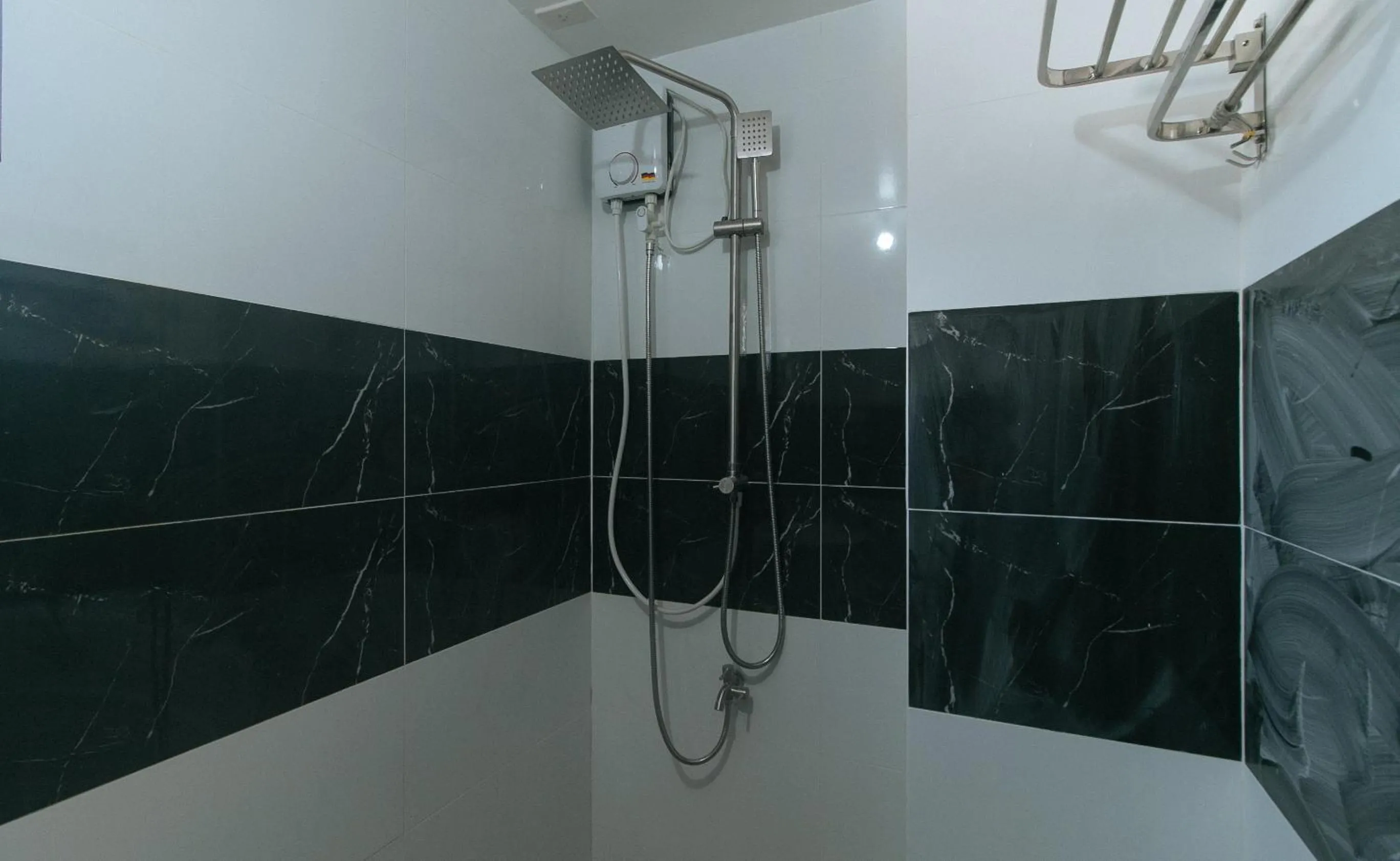 Shower in Sans Hotel near Enchanted Kingdom Santa Rosa Laguna