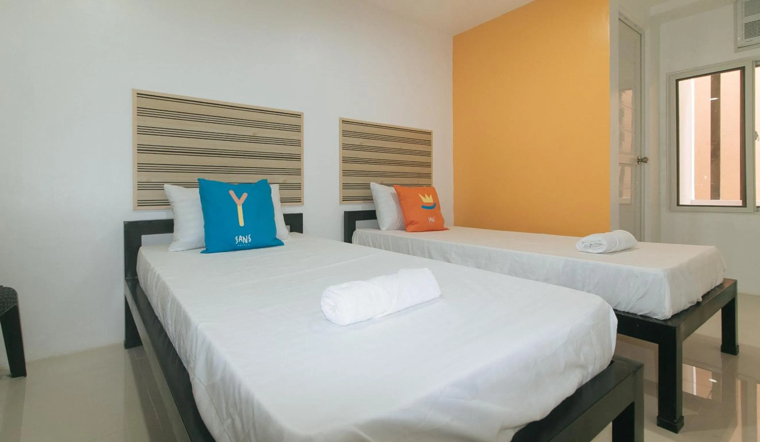 Bed in Sans Hotel near Enchanted Kingdom Santa Rosa Laguna