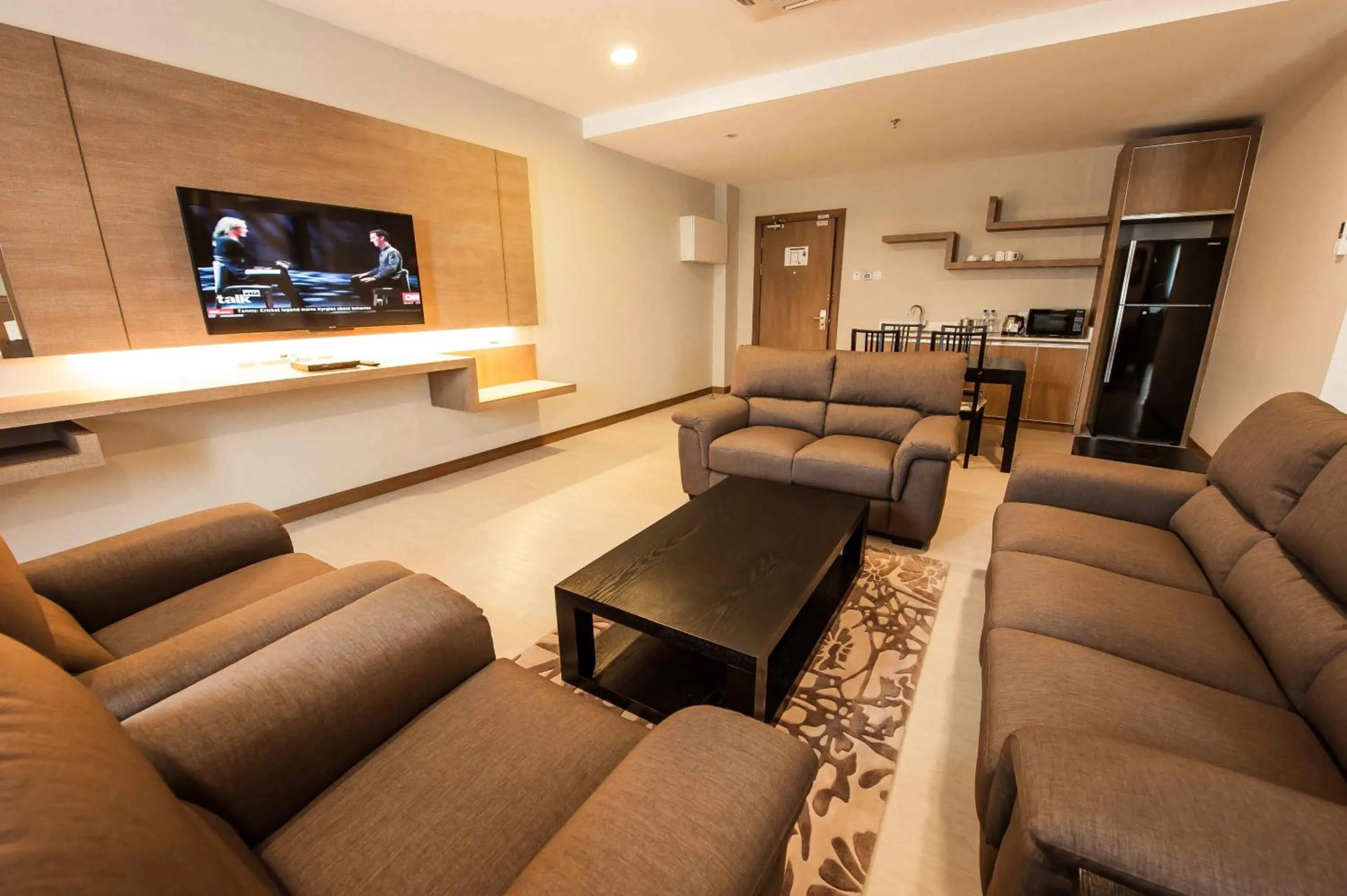 Communal lounge/ TV room in Garden Sentral Hotel