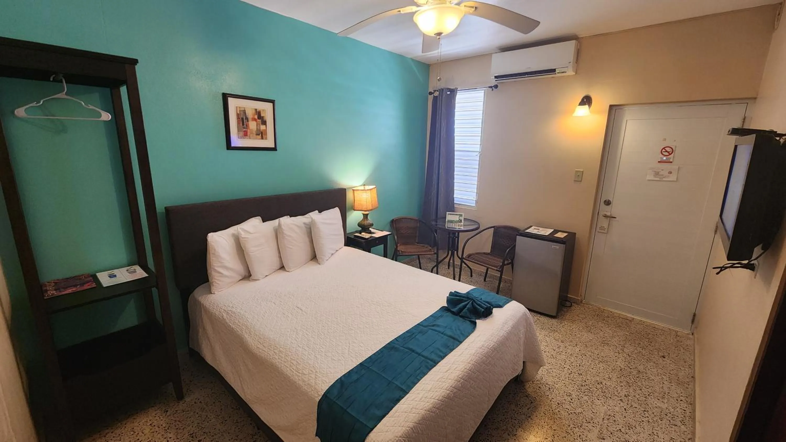 Bed in I Love Combate Rooms & Suites