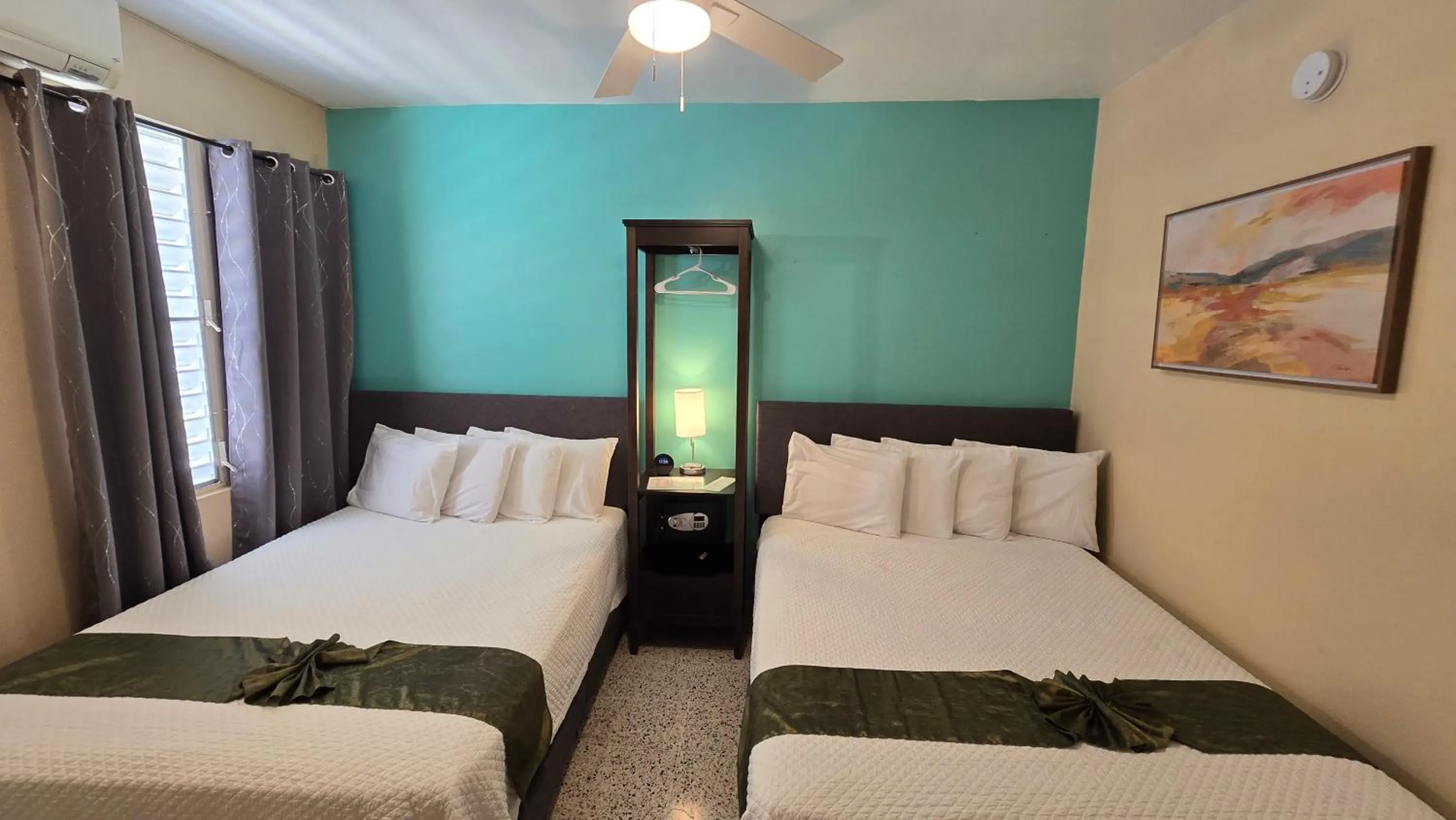 Bed in I Love Combate Rooms & Suites