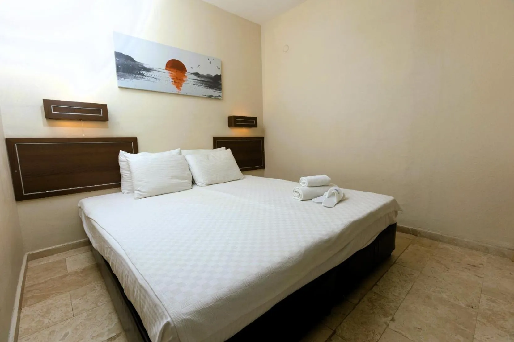 Bed in The Aegean Gate Hotel