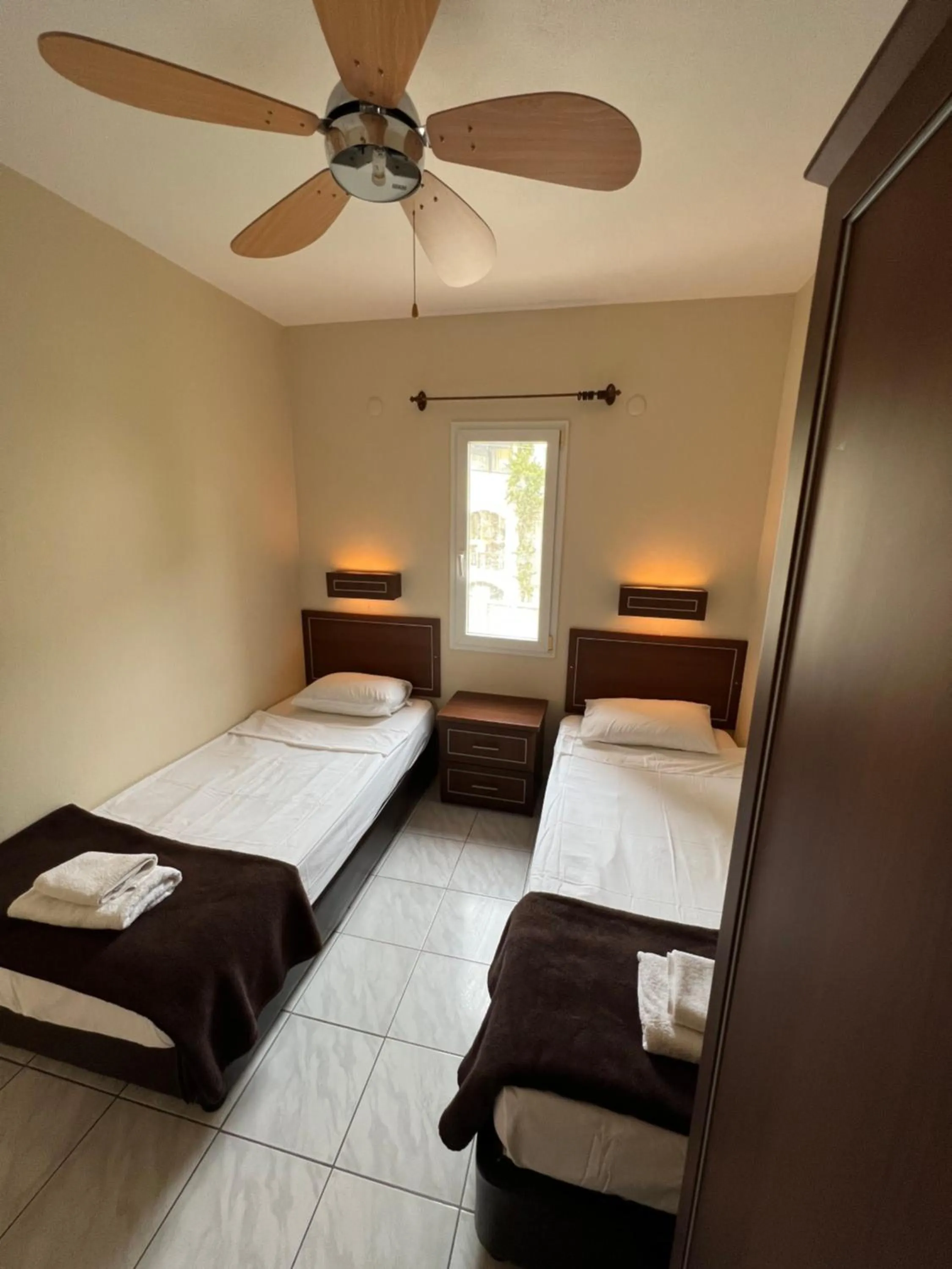 Bed in The Aegean Gate Hotel