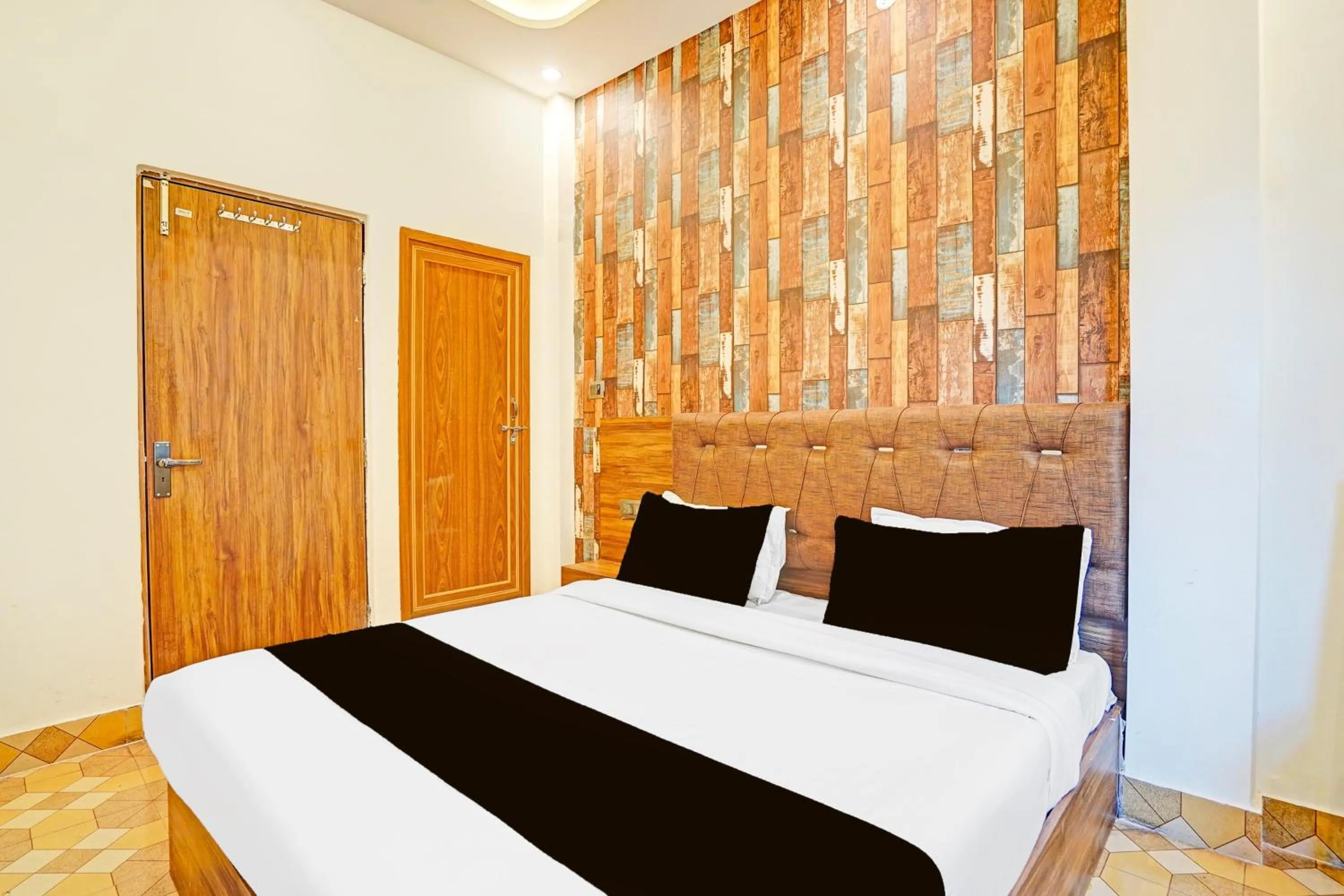 Bedroom in Hotel O MB Grand