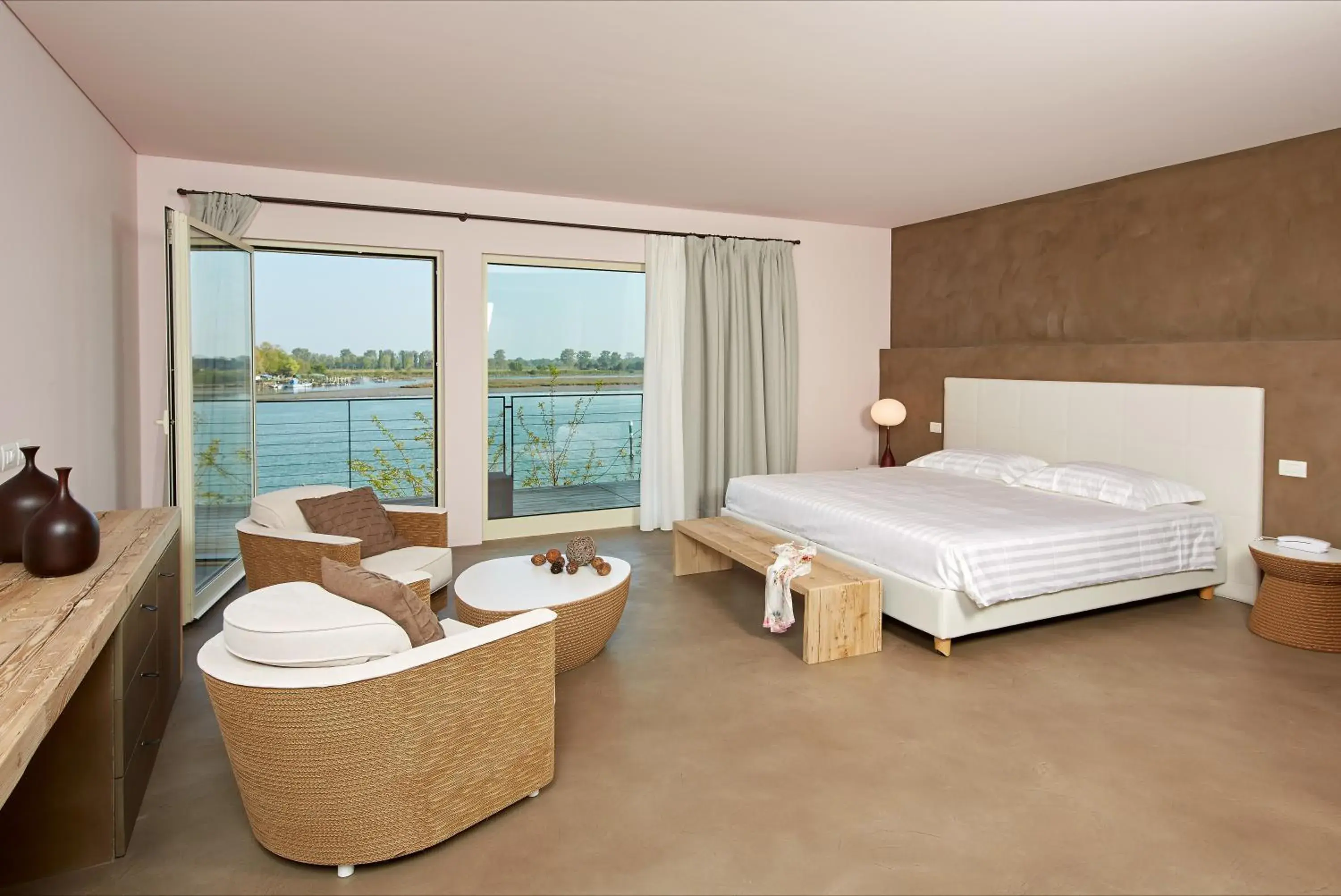 Junior Suite with Balcony and Lagoon View - single occupancy in Boutique Hotel Oche Selvatiche Junior Suite with Balcony and Lagoon View - single occupancy in Boutique Hotel Oche Selvatiche