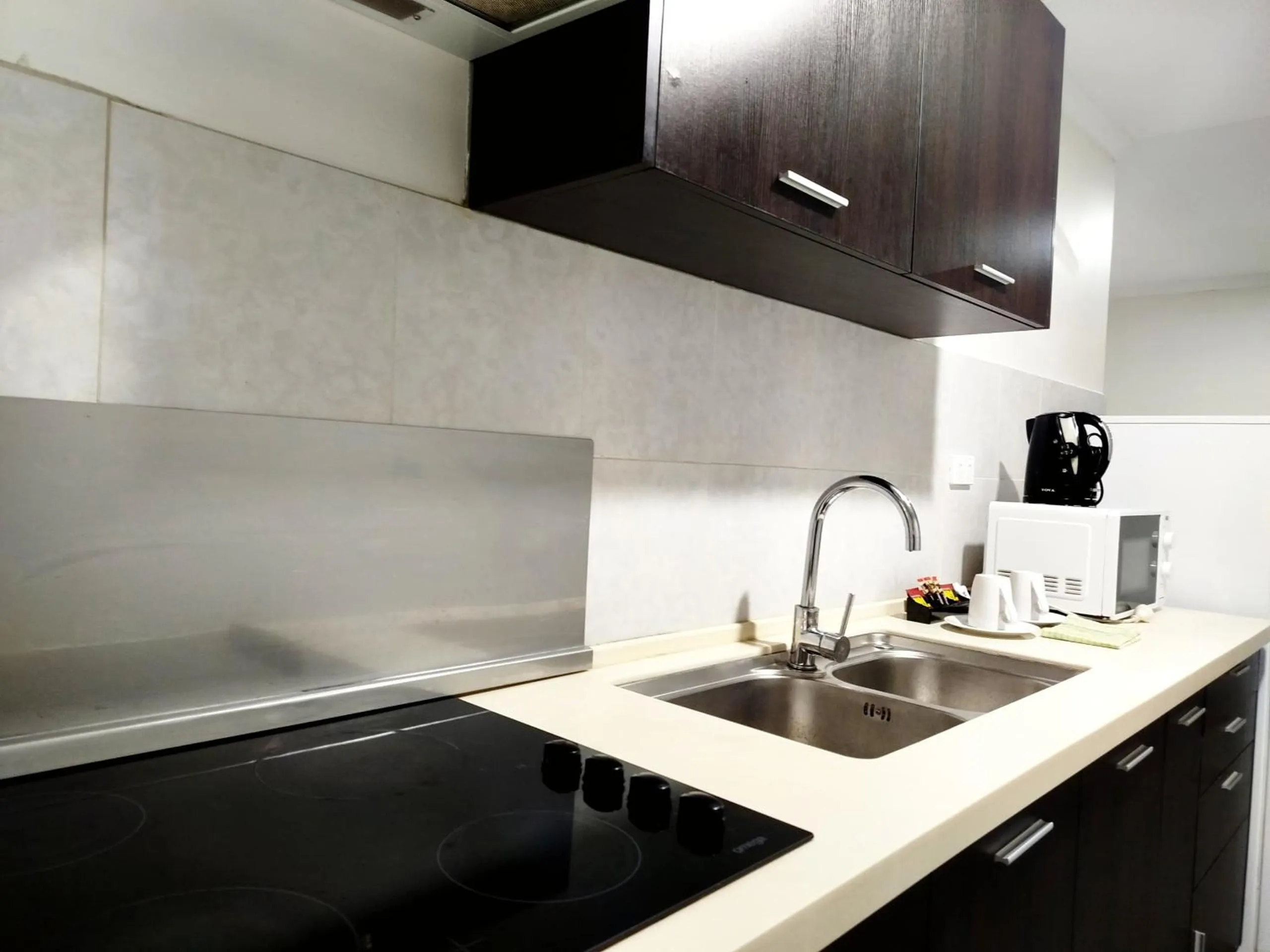 Kitchen or kitchenette in Citi Serviced Apartments - Gaba Place