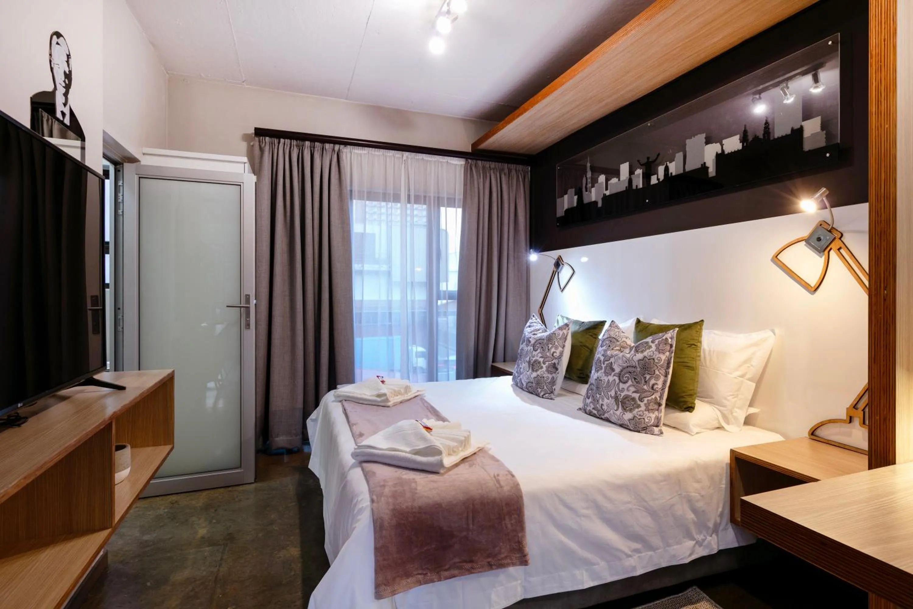 Bed in Akanani Apartments