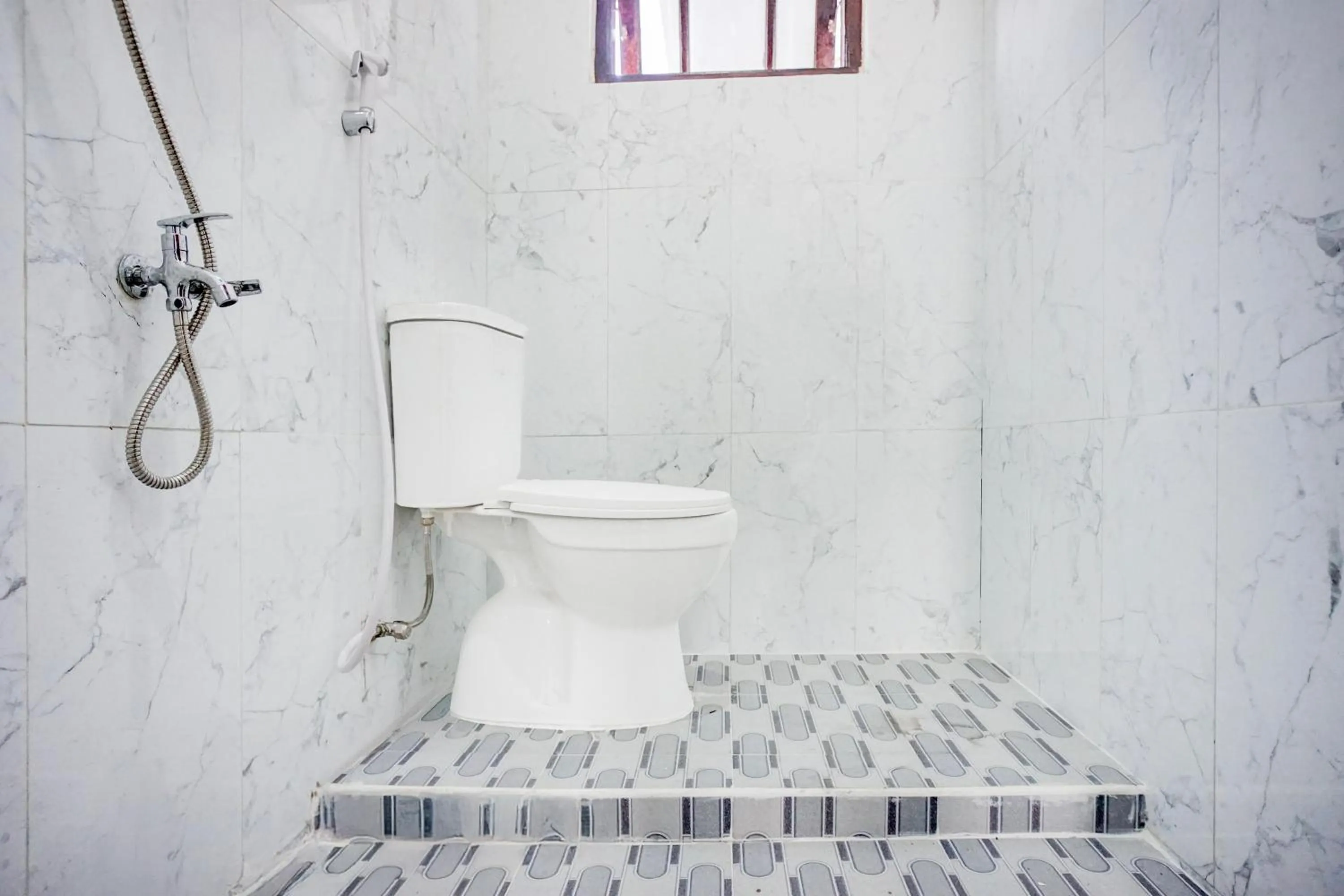 Bathroom in Hotel O Sm Raja Guest House