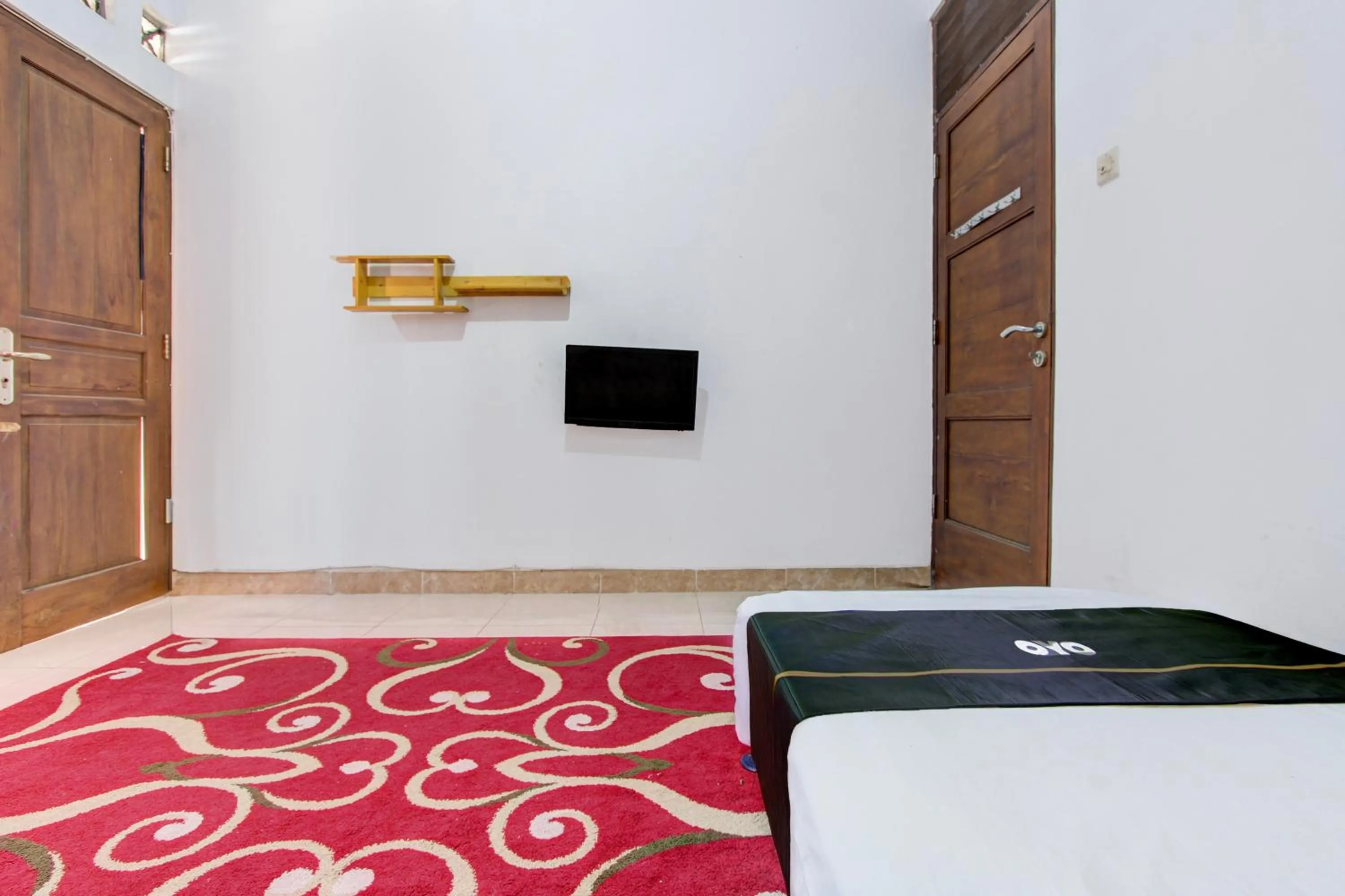 Bed in SPOT ON Podomoro Homestay