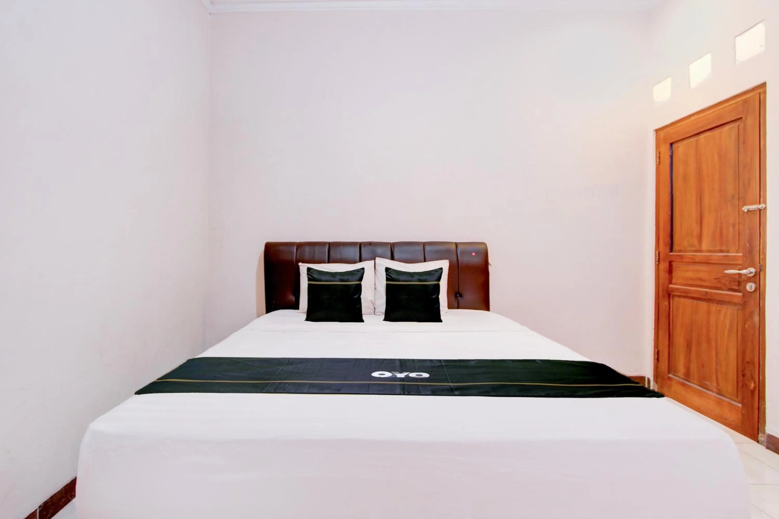 Bed in SPOT ON Podomoro Homestay