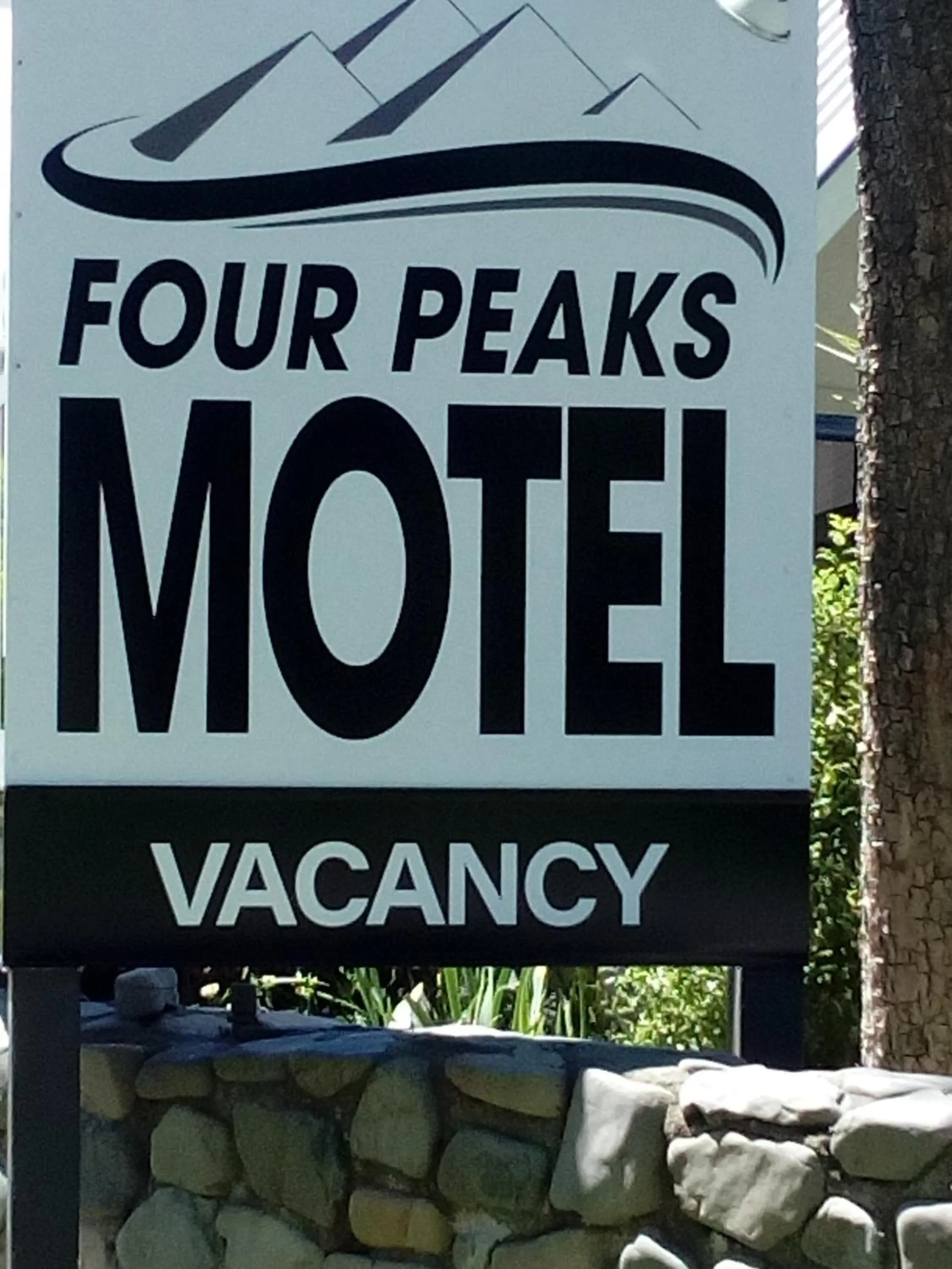Property logo or sign in Four Peaks Motel