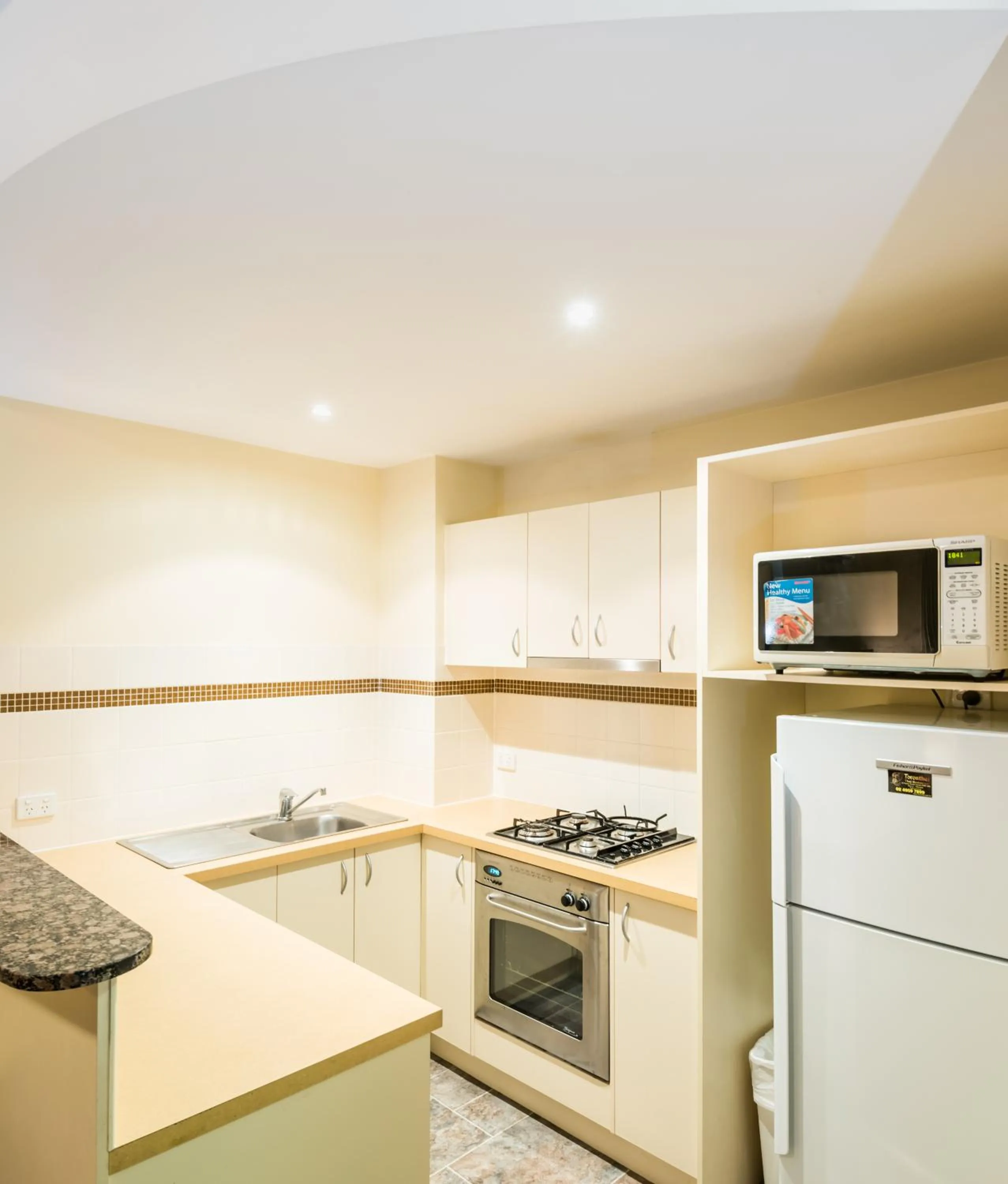 Kitchen or kitchenette in The Brighton Apartments