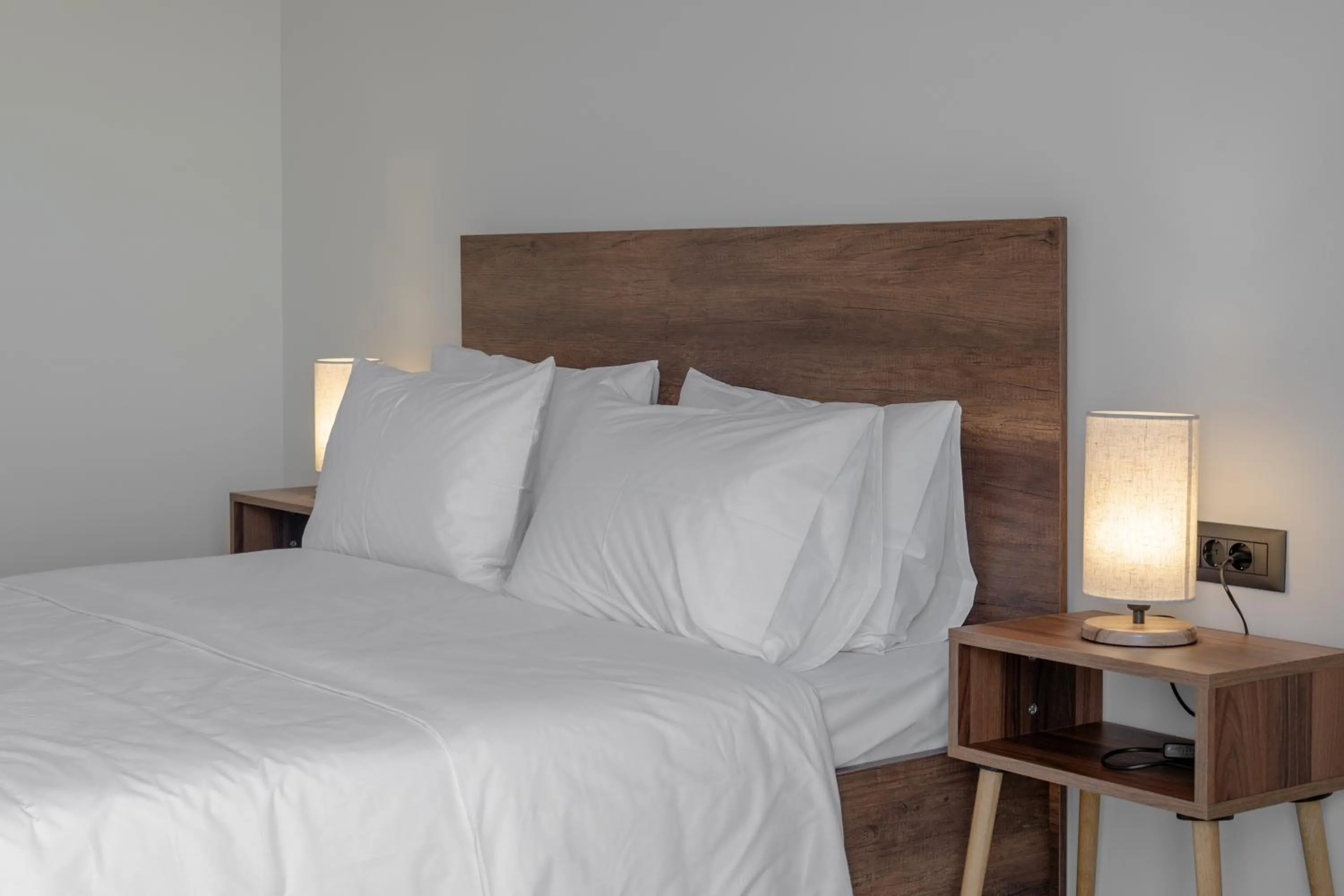 Bed in Trinity Suites "by Checkin"