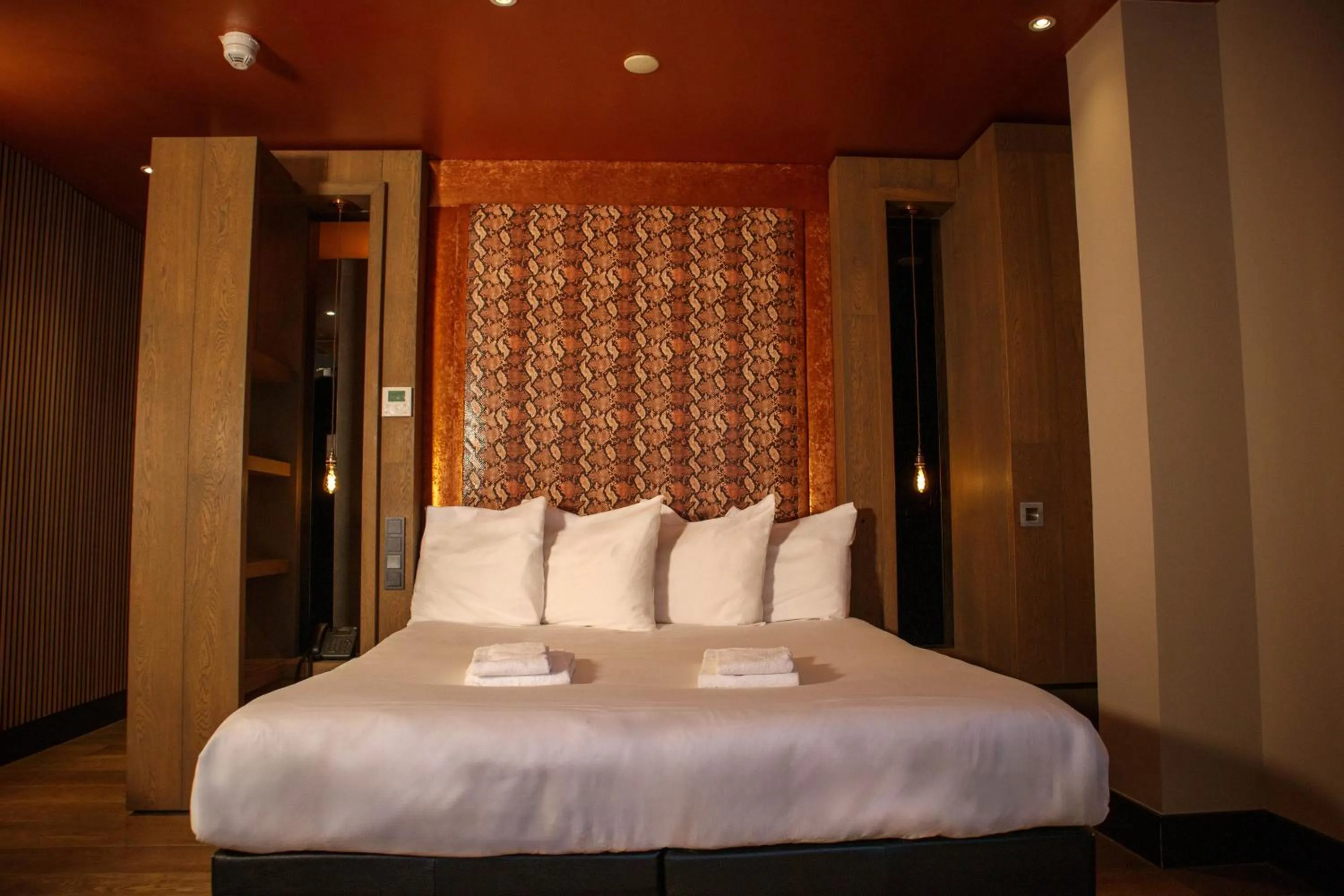 Bed in Manzo's Suites